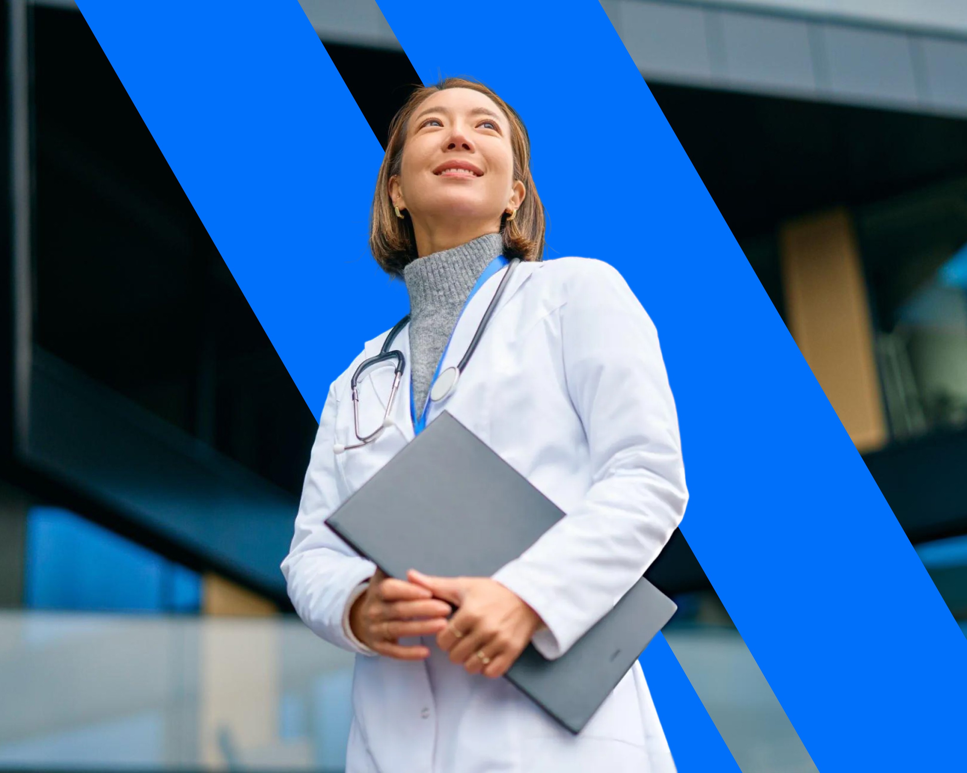 person sitting on grass and using phone