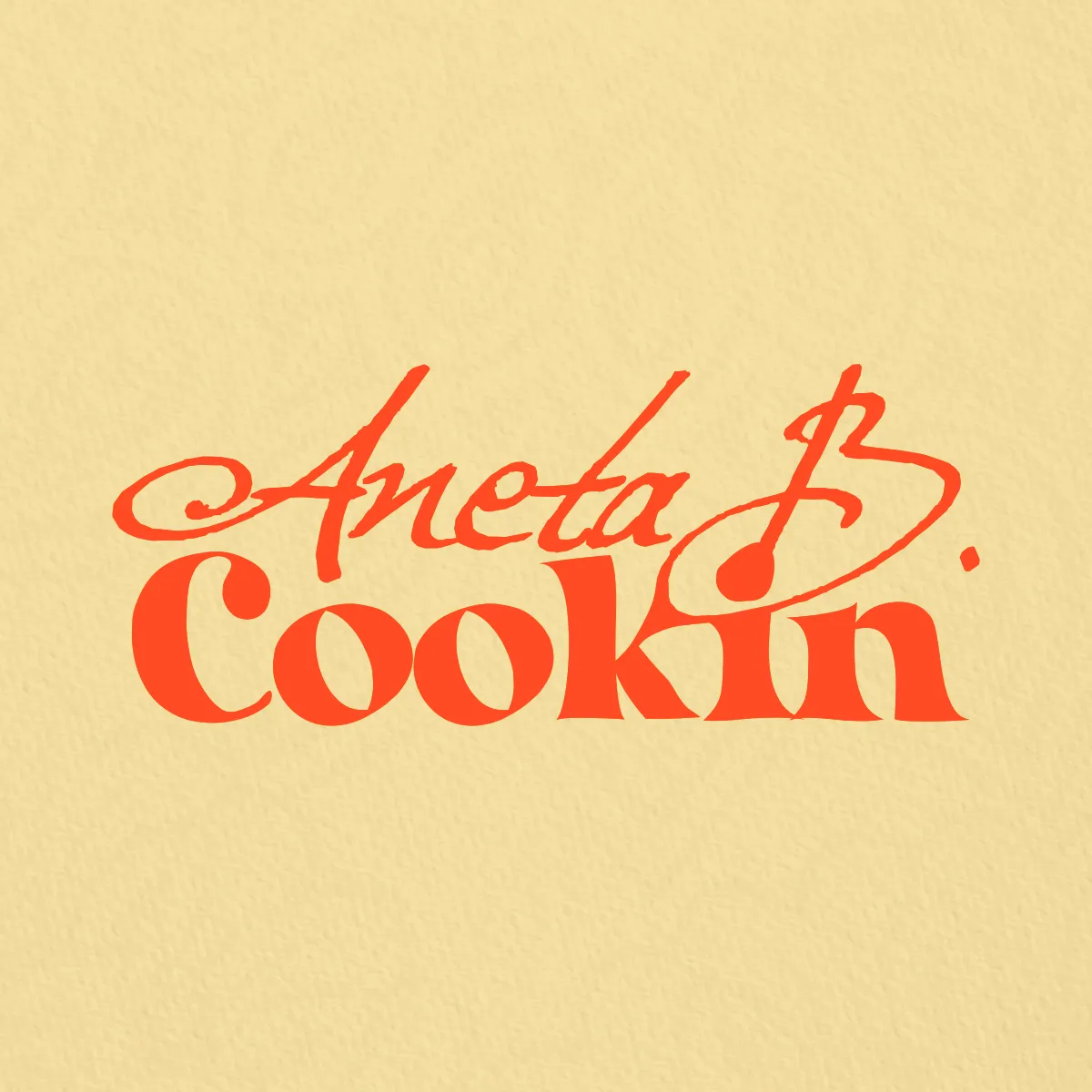Aneta B. Cookin case study: cursive orange wordmark logo on a warm yellow background