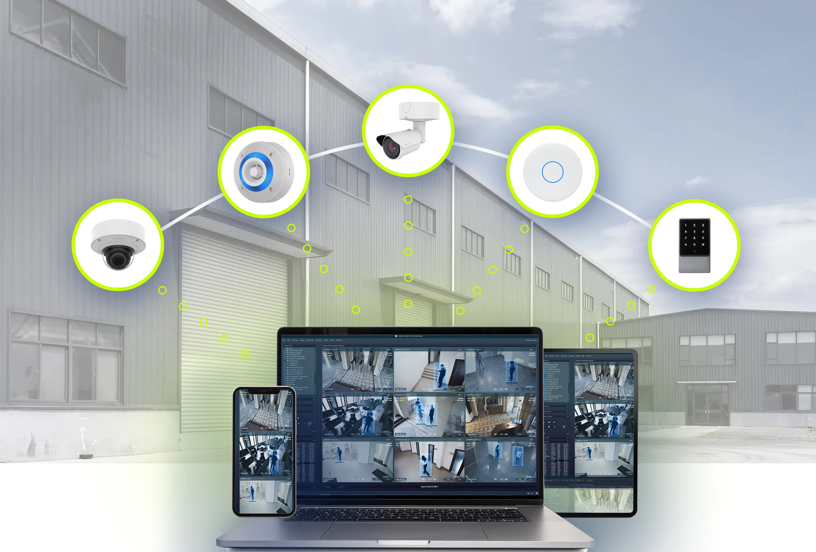 Photo of a laptop, tablet and mobile device supported by 5 icons representing low voltage products outside an industrial warehouse