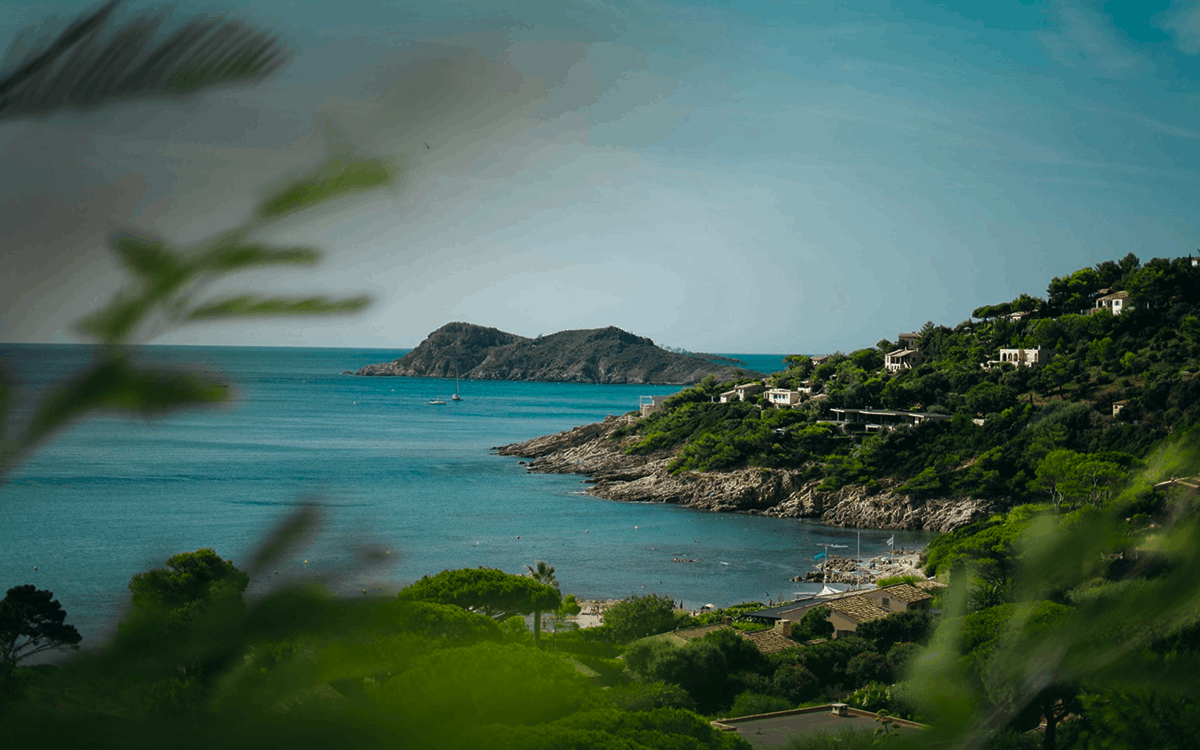 A coastal town with buildings and a bay.