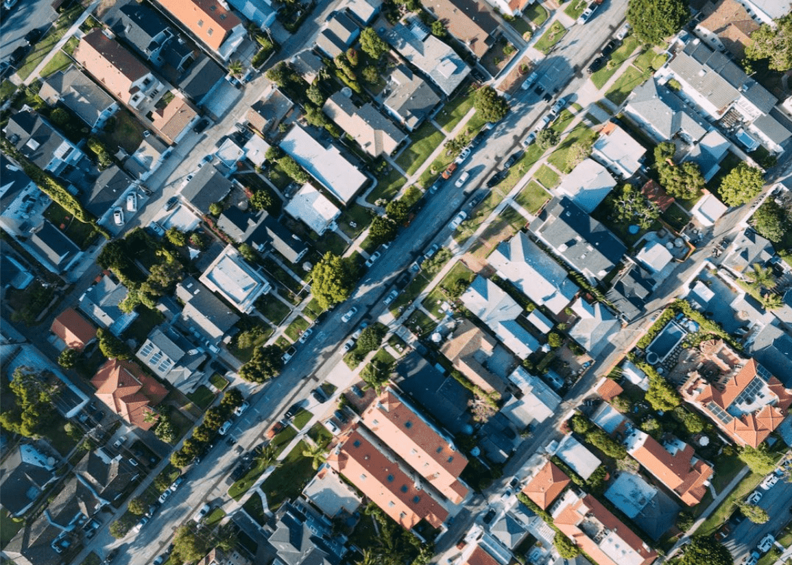 Aerial view of suburban houses and streets.