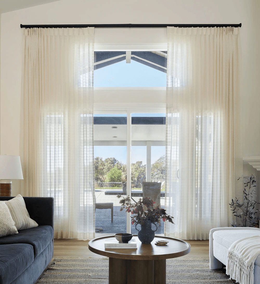 Drapes install in a living room in Houston, Texas