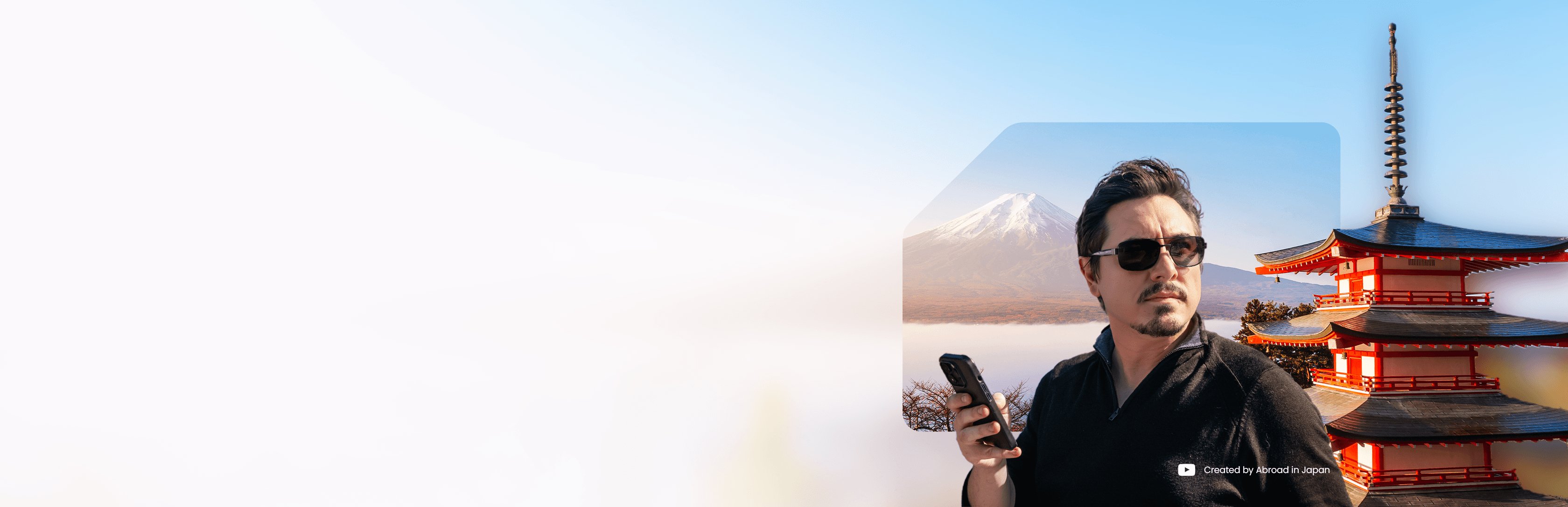Chris Broad holding a phone with eSIM in front of Mt. Fuji