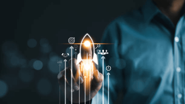 a laptop computer sitting on top of a wooden desk