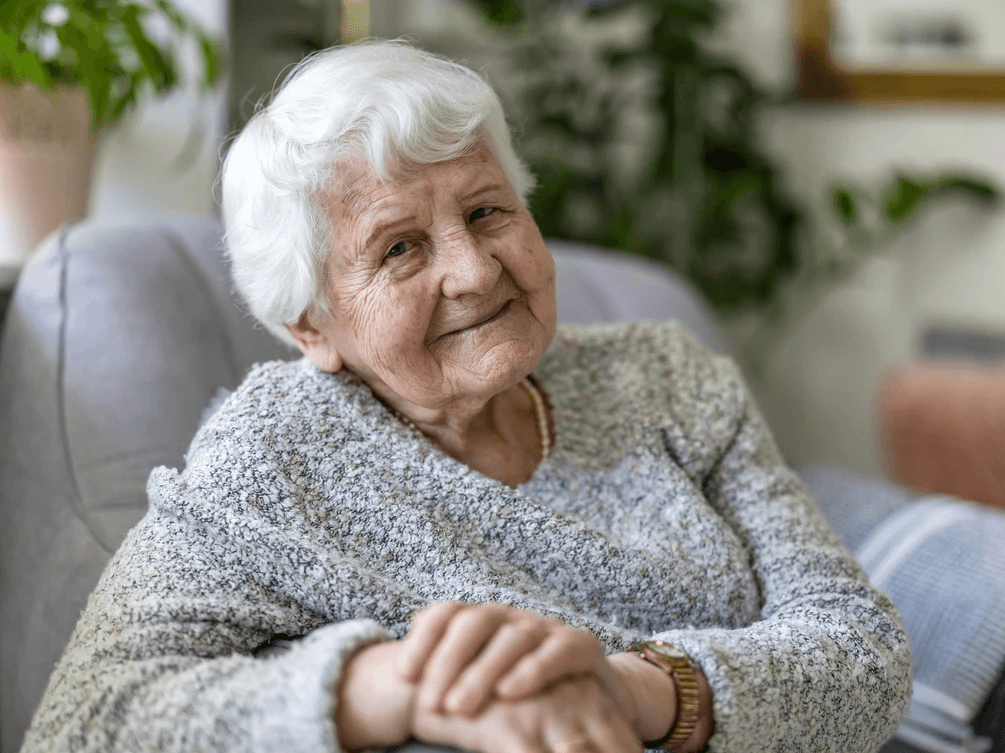 an older woman with white hair and a smile