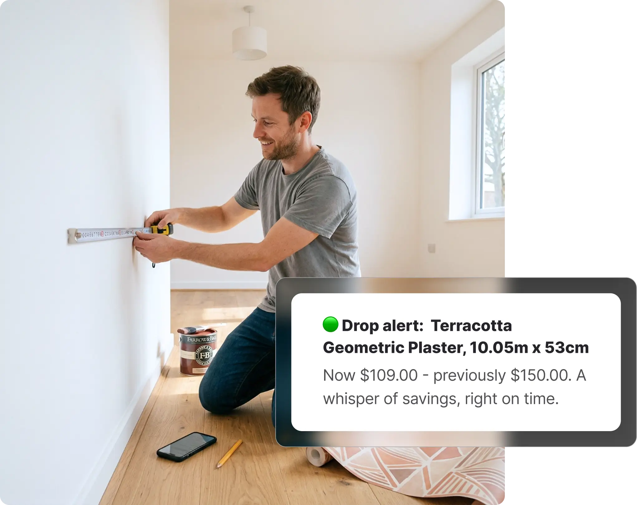 Man measuring a wall with a tape measure during a home renovation, with a paint tin on the floor beside him, receiving a Bunnings price drop alert on Whisprice.