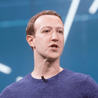 A person speaking into a microphone

AI-generated content may be incorrect.