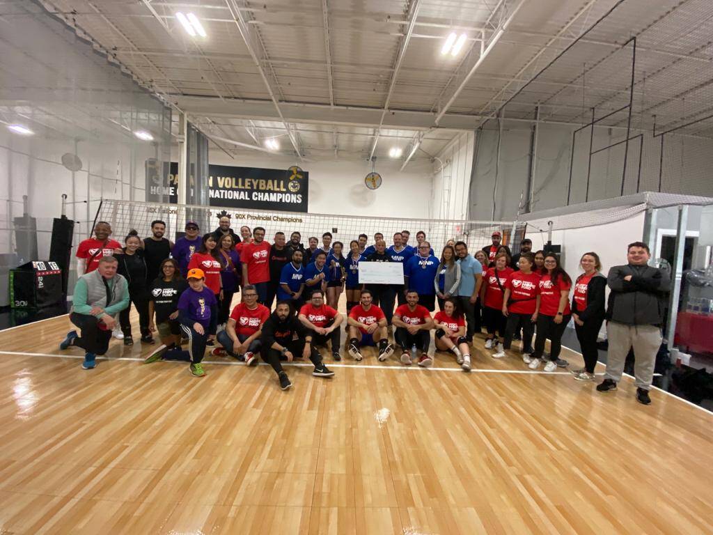 Osmow's annual charity volleyball tournament team photo raising funds for the Hope Fund
