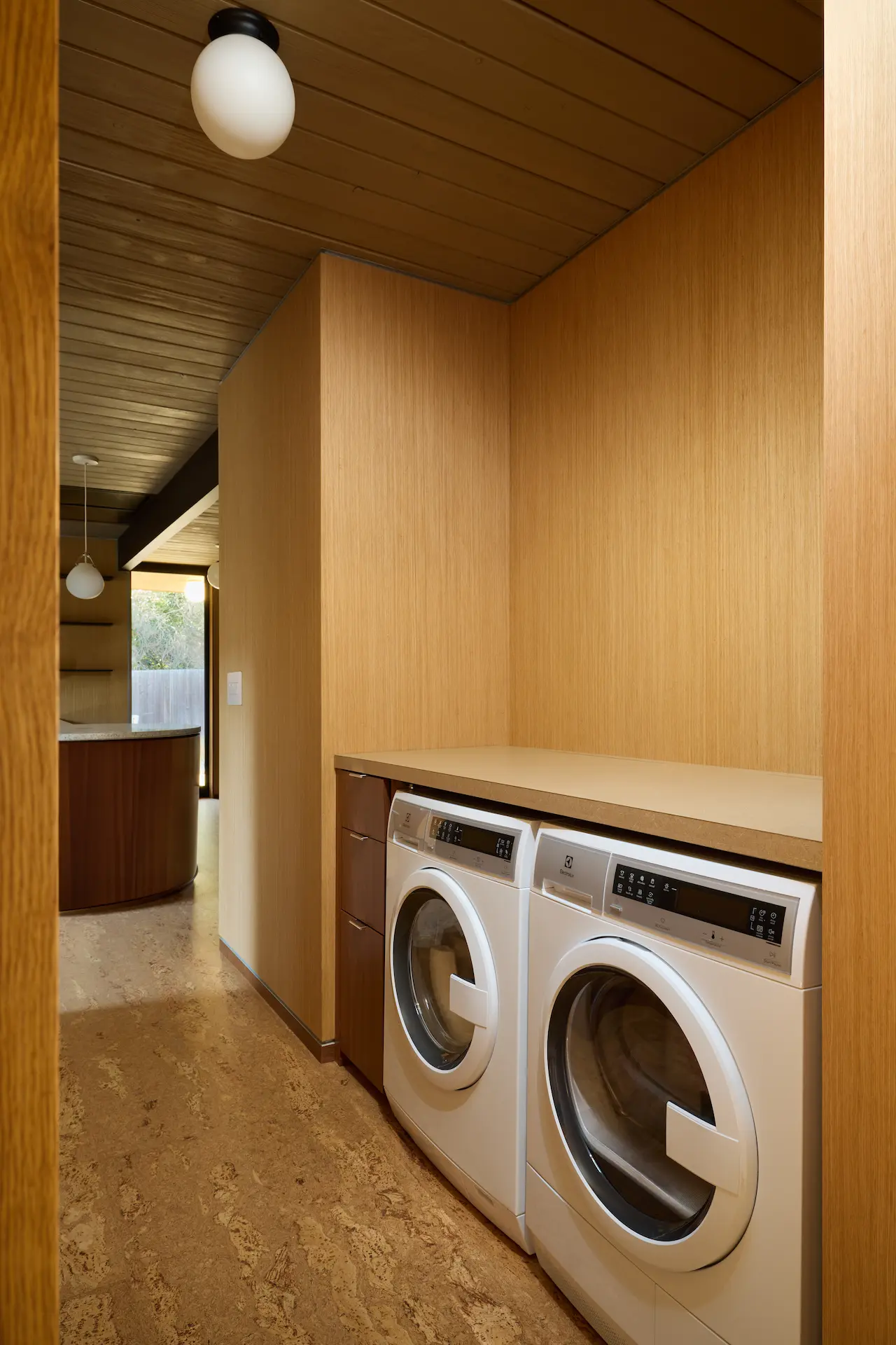 Portrait of the hallway laundry station, a modern addition that enhances the functionality of this Eichler home in the Fairhills Tract. Photo by Todd Huge.