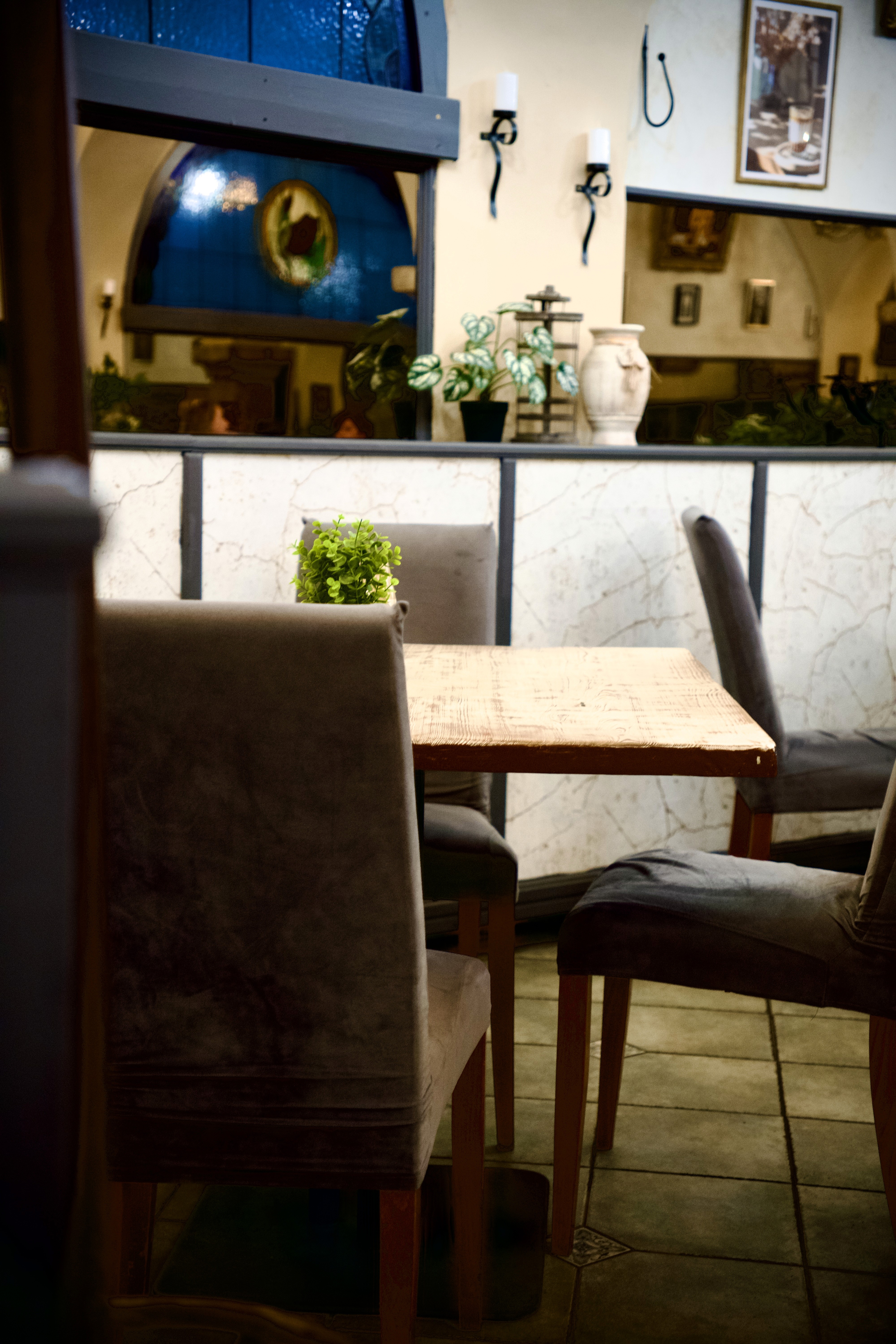 Smiling young man in yellow shirt holding laptop