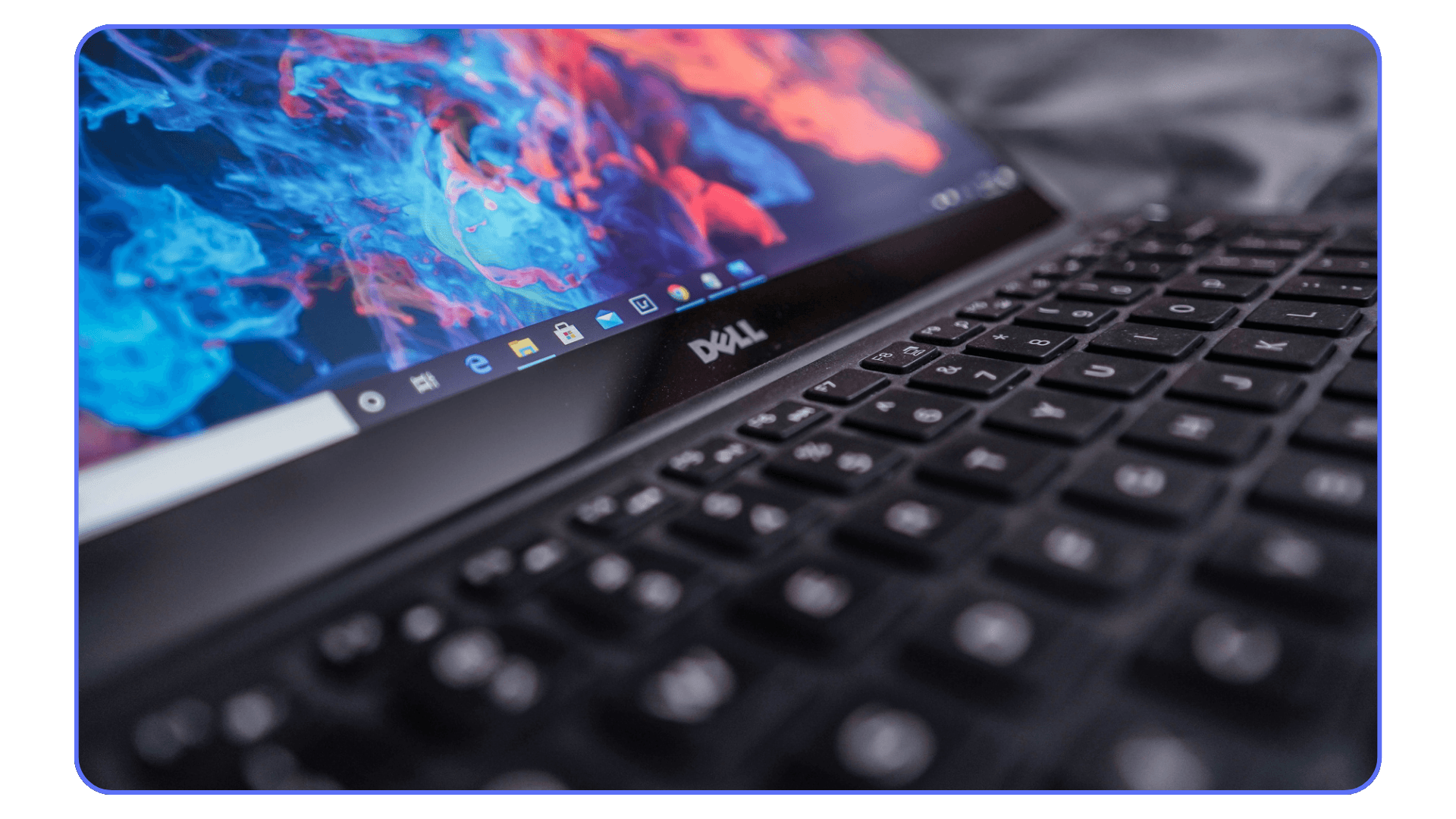 Close-up of Dell laptop keyboard and high-resolution display for creative work
