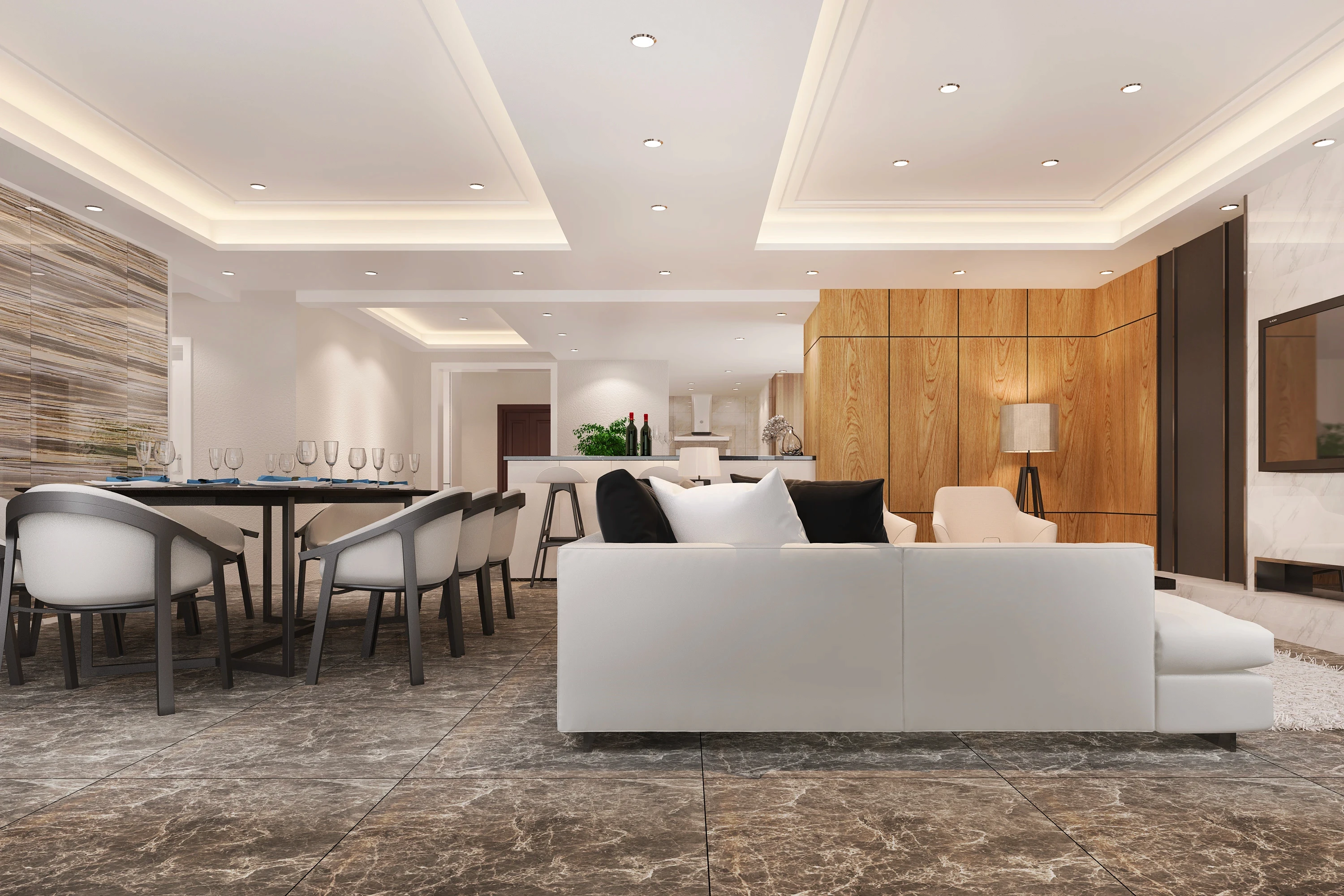 Spacious open-concept living area with white sofa, modern seating, and recessed ceiling lighting.