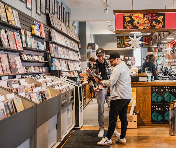 Ryan Truax and Michael Sacca looking at records at Electric Fetus