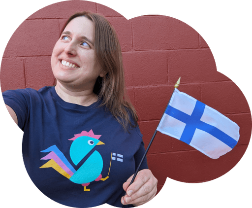 Saara wearing the Appiskukko shirt, holding the Finnish flag nad looking off camera