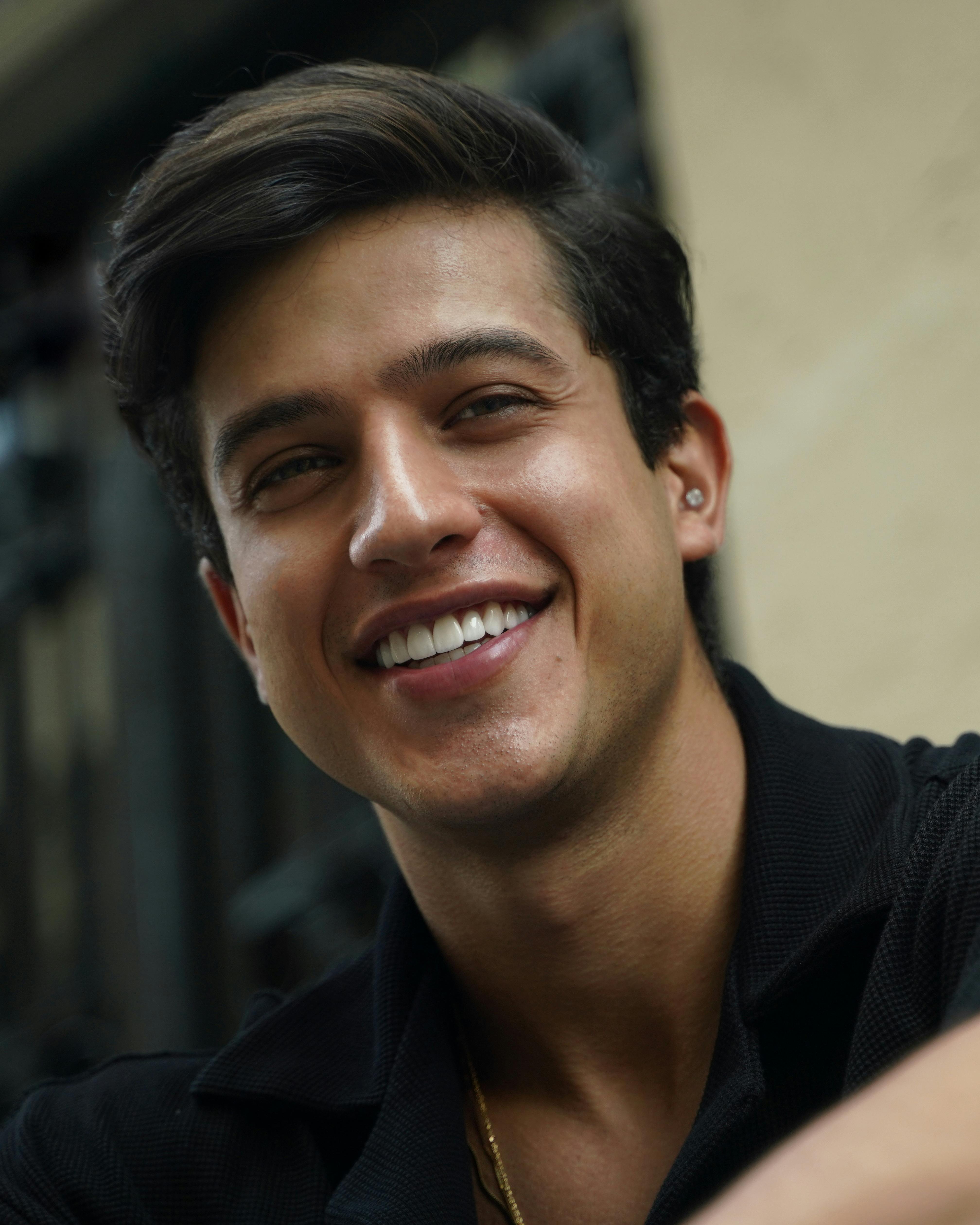 selective focus photo of woman wearing black scoop-neck top
