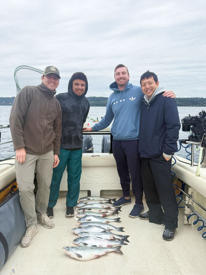 bachelor party fishing salmon at a seattle fishing charter boat