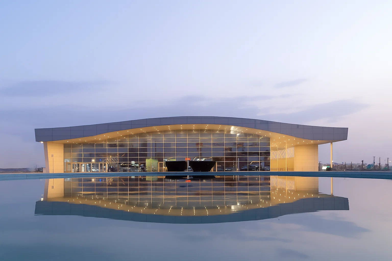 Abstract gradient design featuring smooth transitions from dark gray to black.