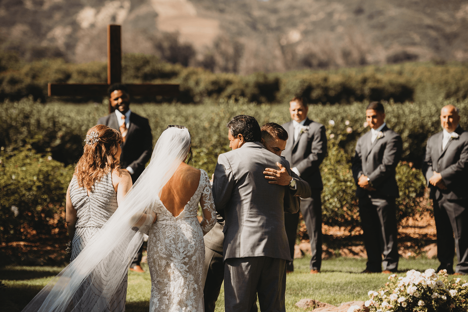 Flat lay wedding details with bouquet, rings, and sparkling bridal heels