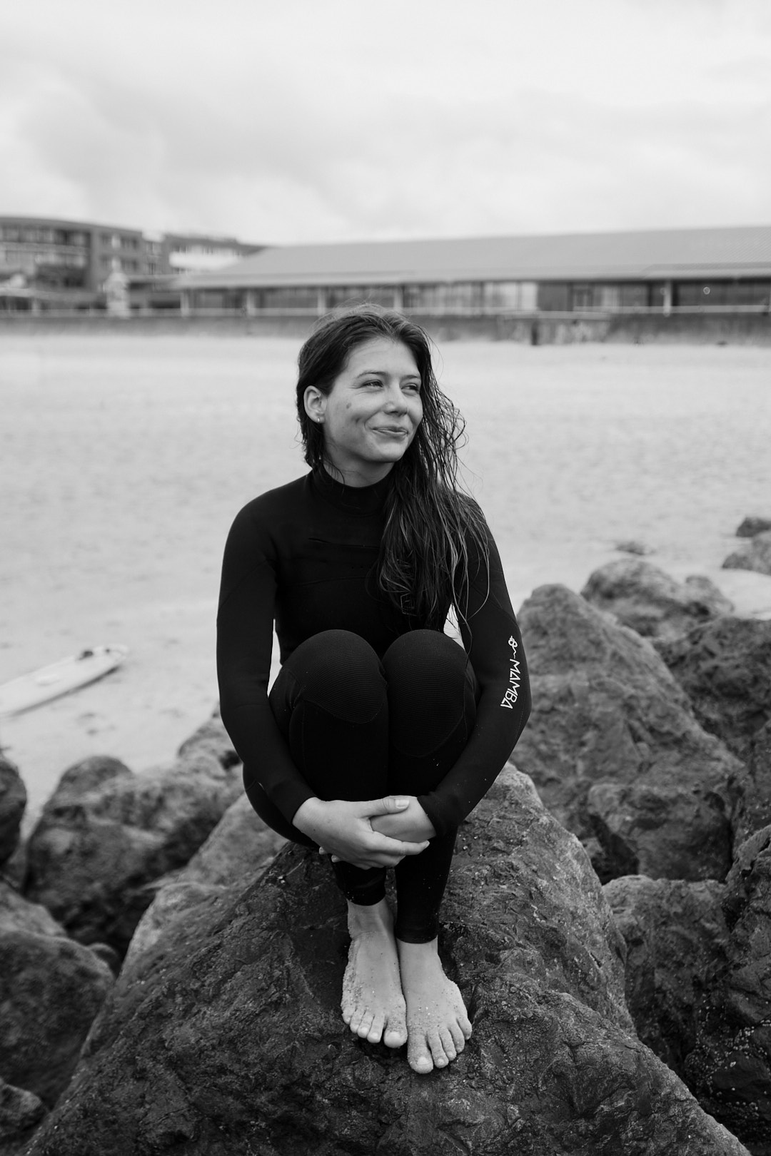 surfer girl in wetsuit