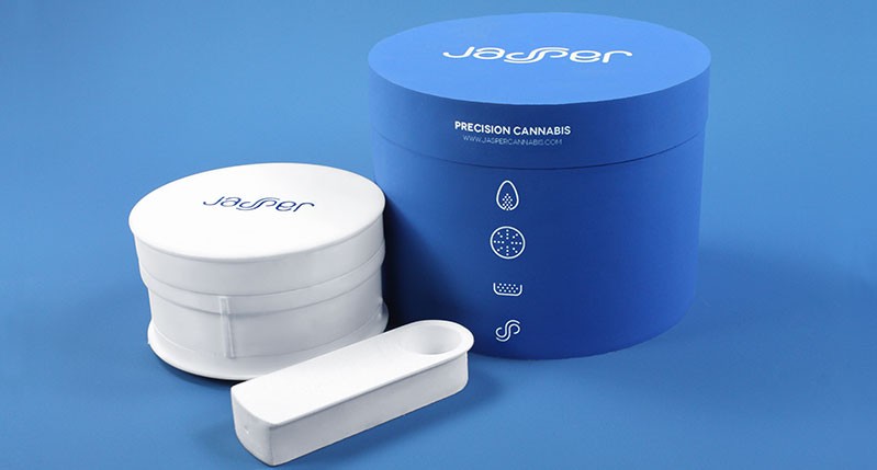 A set of round, white and blue boxes with the stylized text logo Jasper. There is also some stick like white box with a finger hole in it.