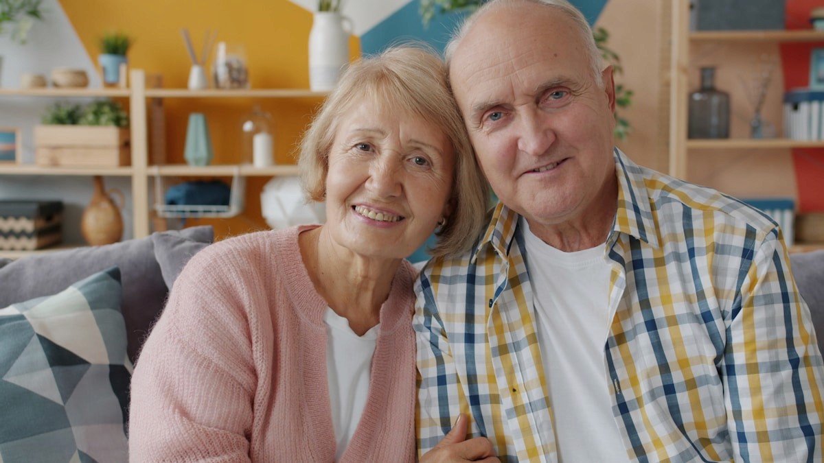 Older couple sitting together at home