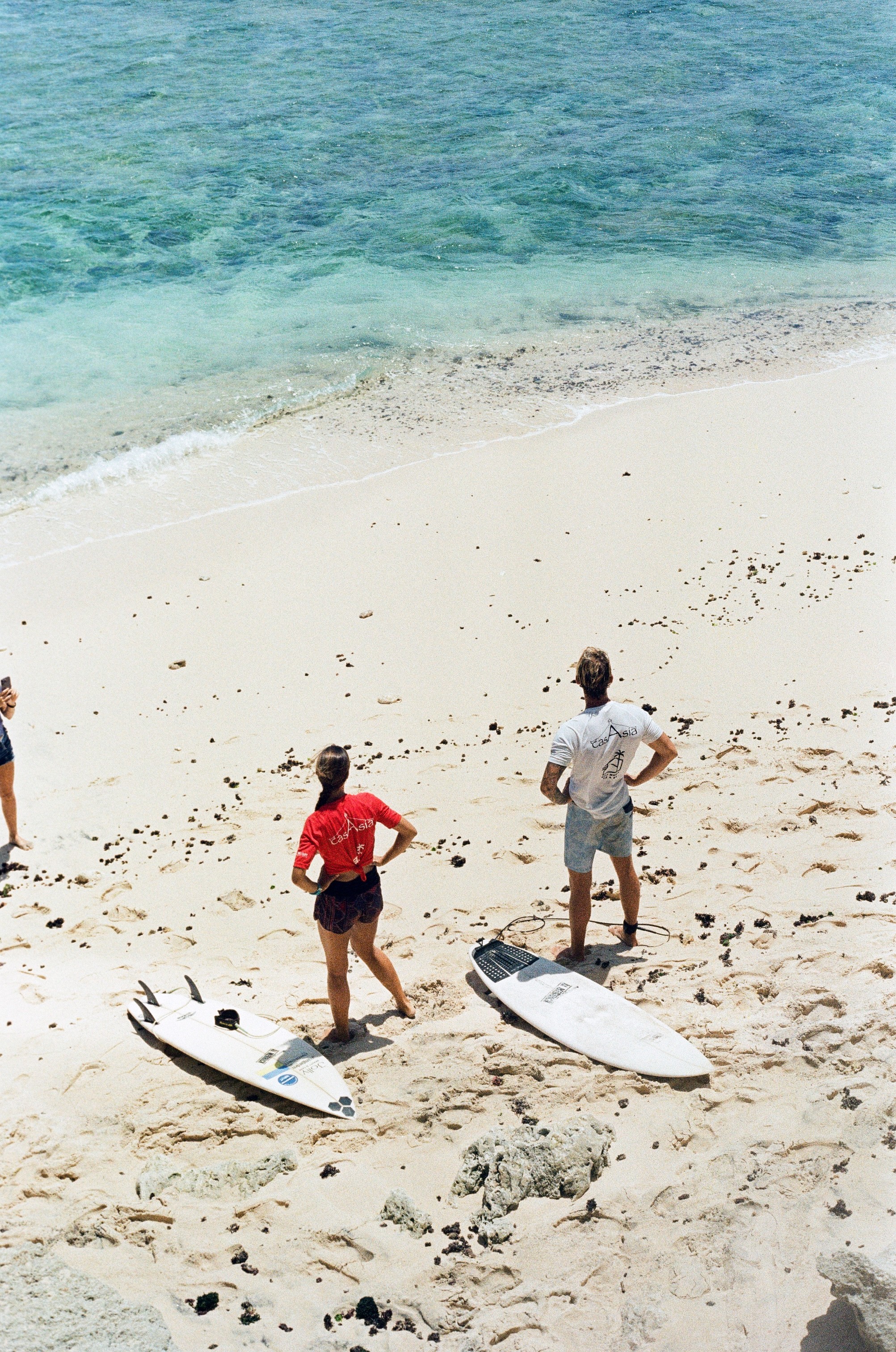 film photo of the surfers getting ready to surf 