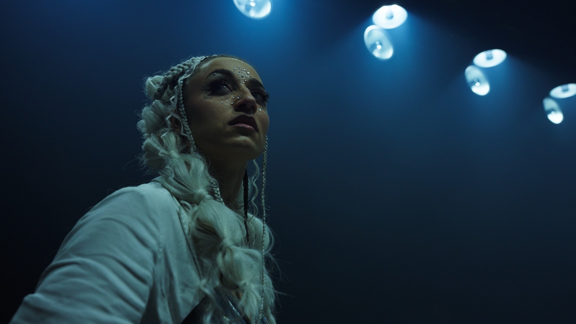 Stack of books with modern publishing design placed on bright white stairs