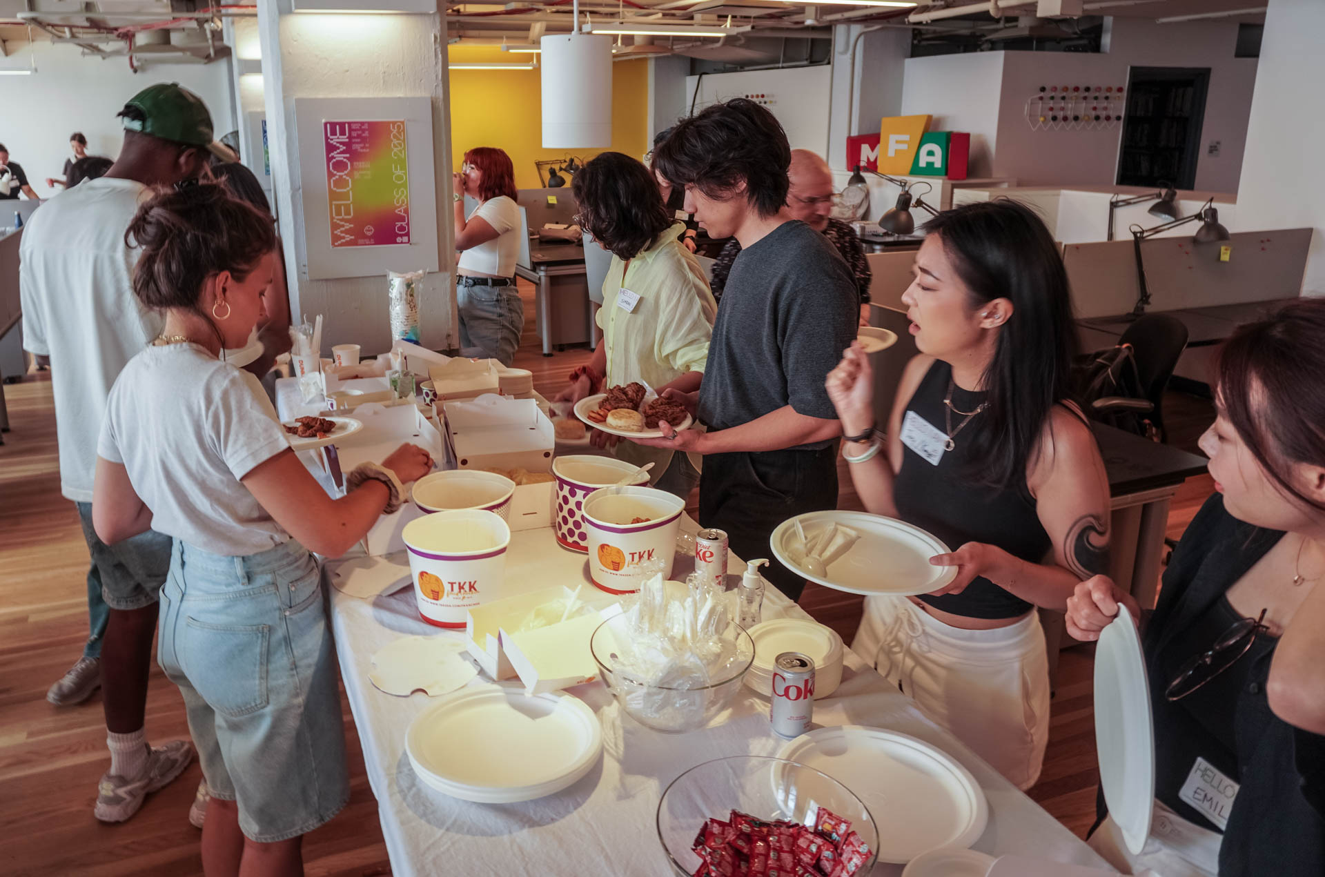 group shot of students eating in the studio, class of 2025