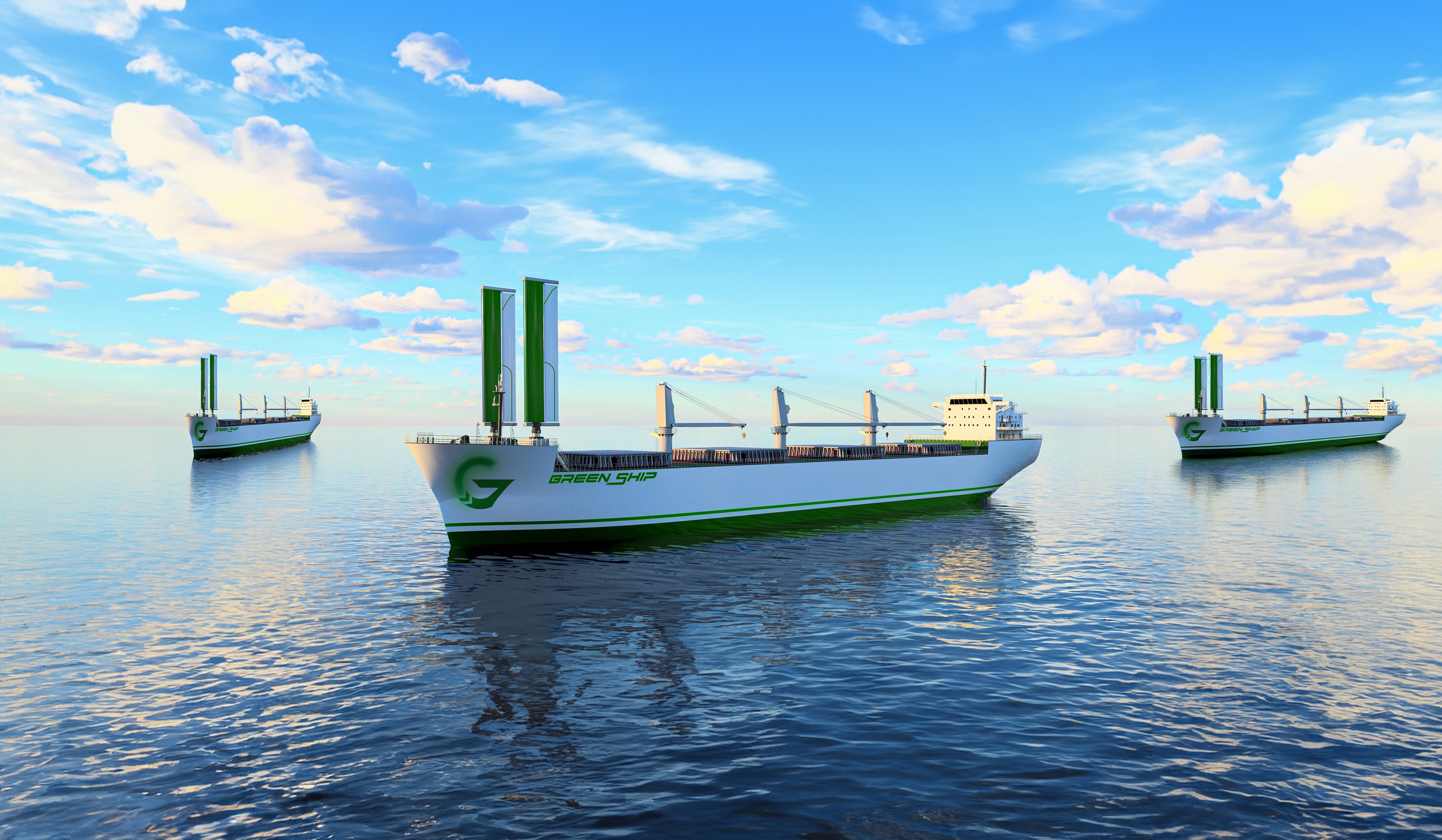 Three 'Green Ship' cargo vessels with green vertical sails at sea.