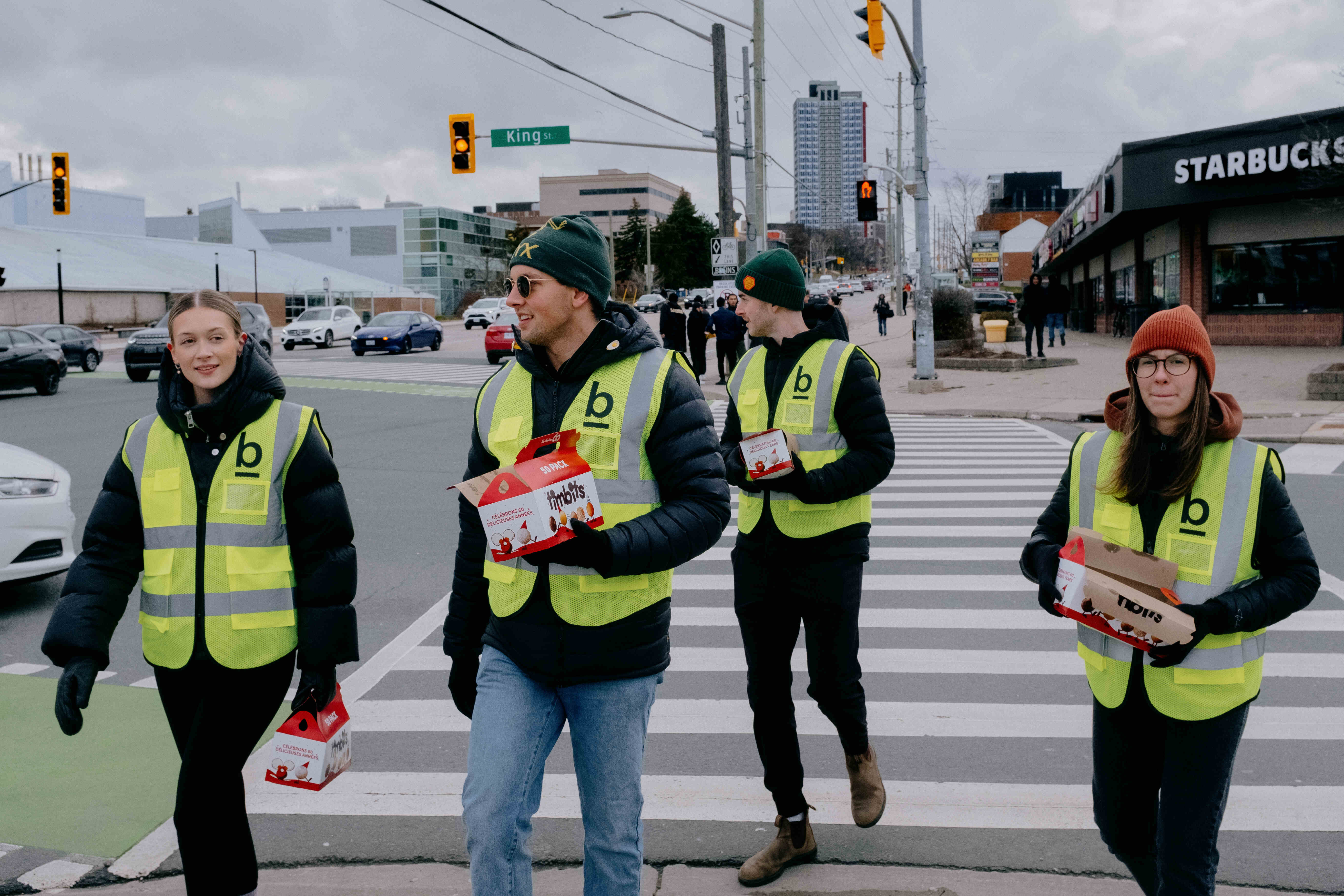 members of Base Church handing out timbits to students on St. Patricks Day in Waterloo