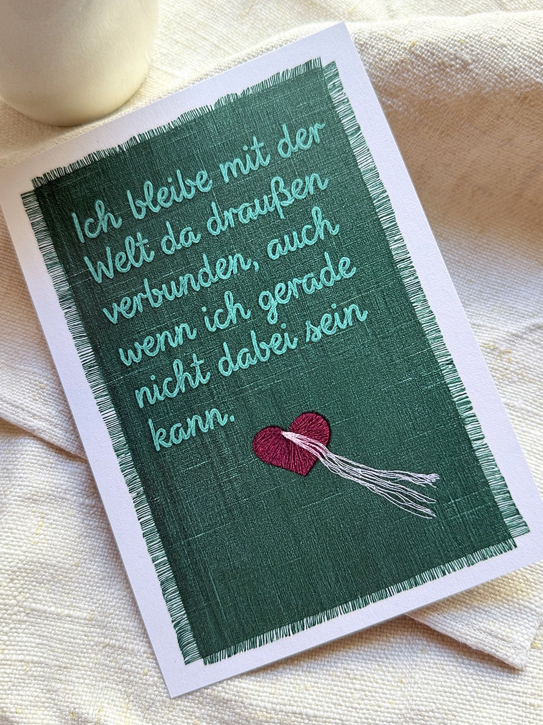 A Card with a embroidered Text