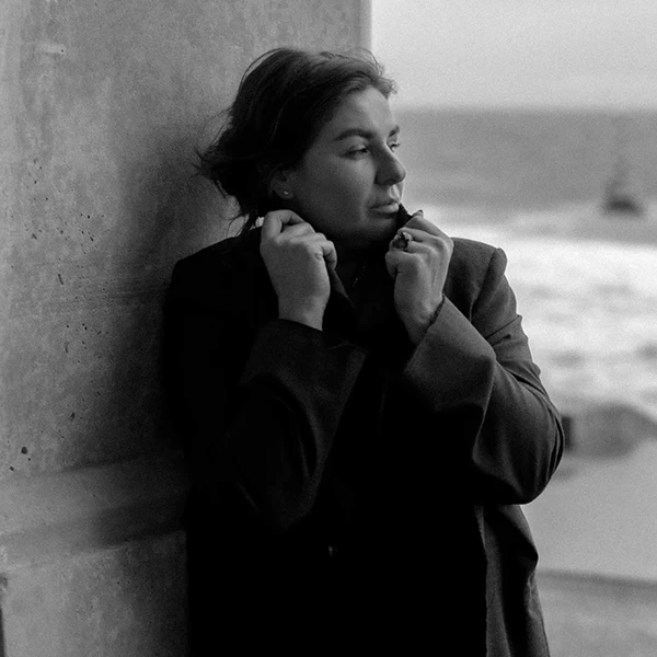 Black and white photo of man posing on camera