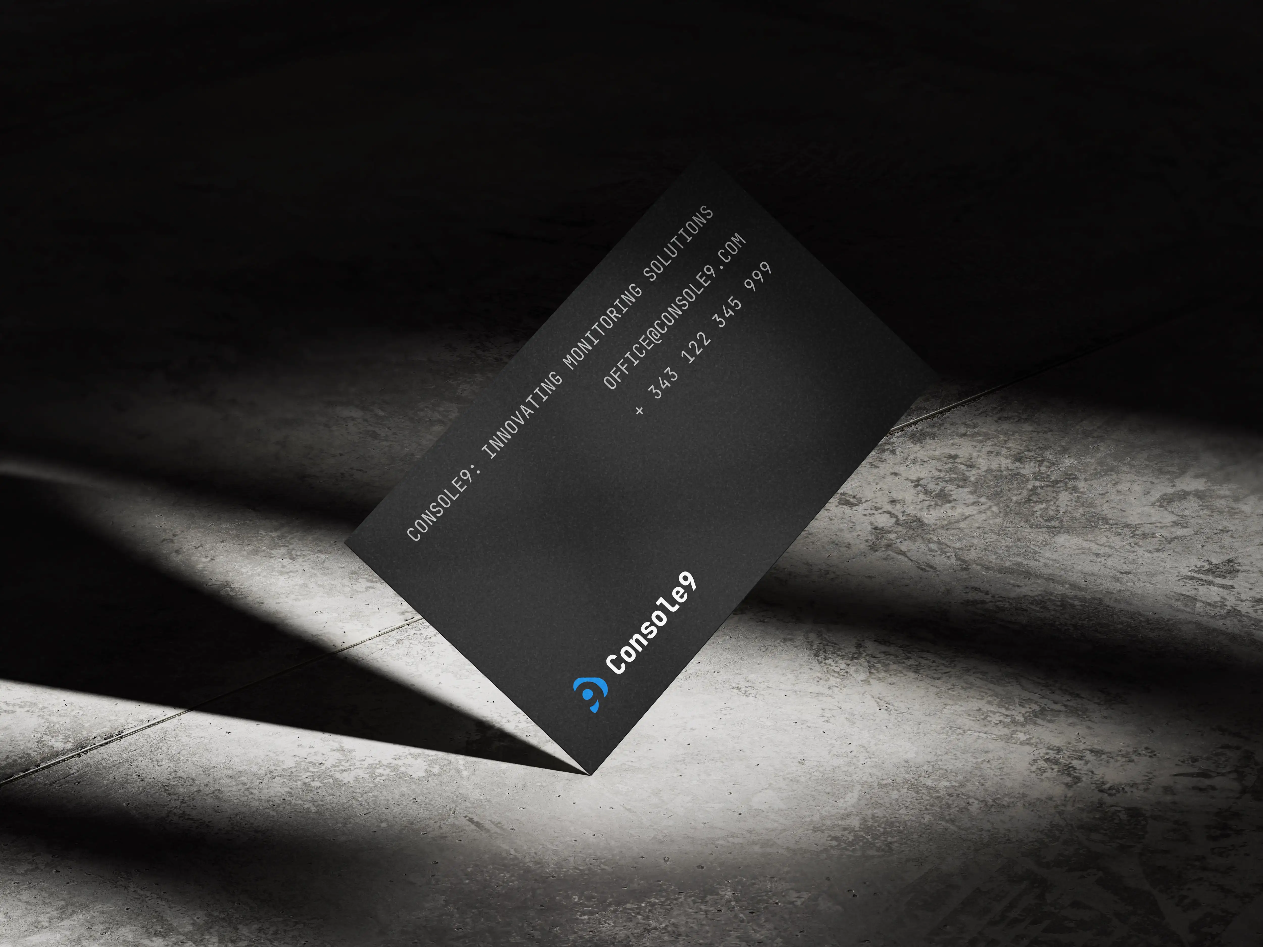 Mock-up with Console9 business card, concrete background