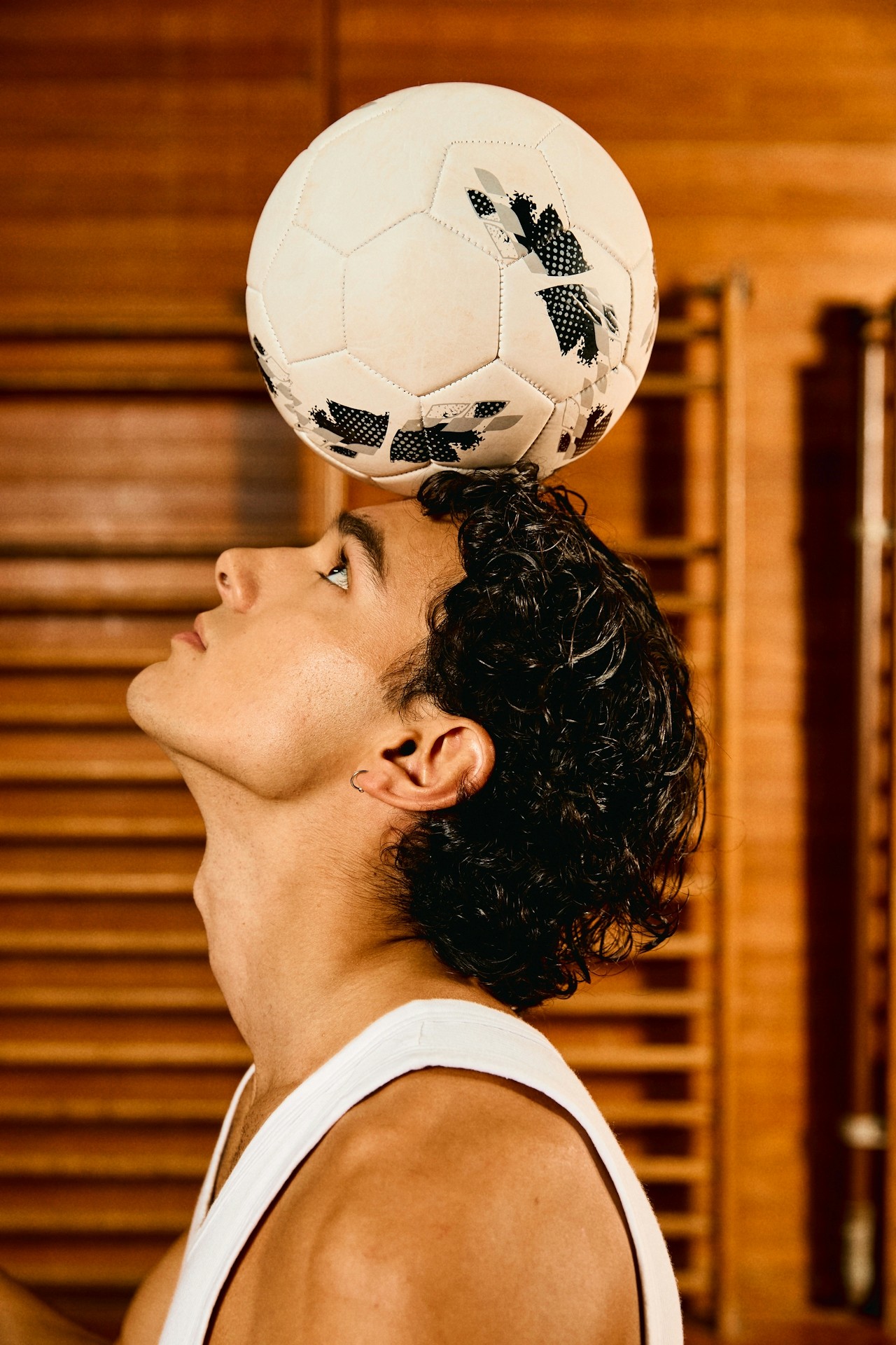 Football balanced on forehead