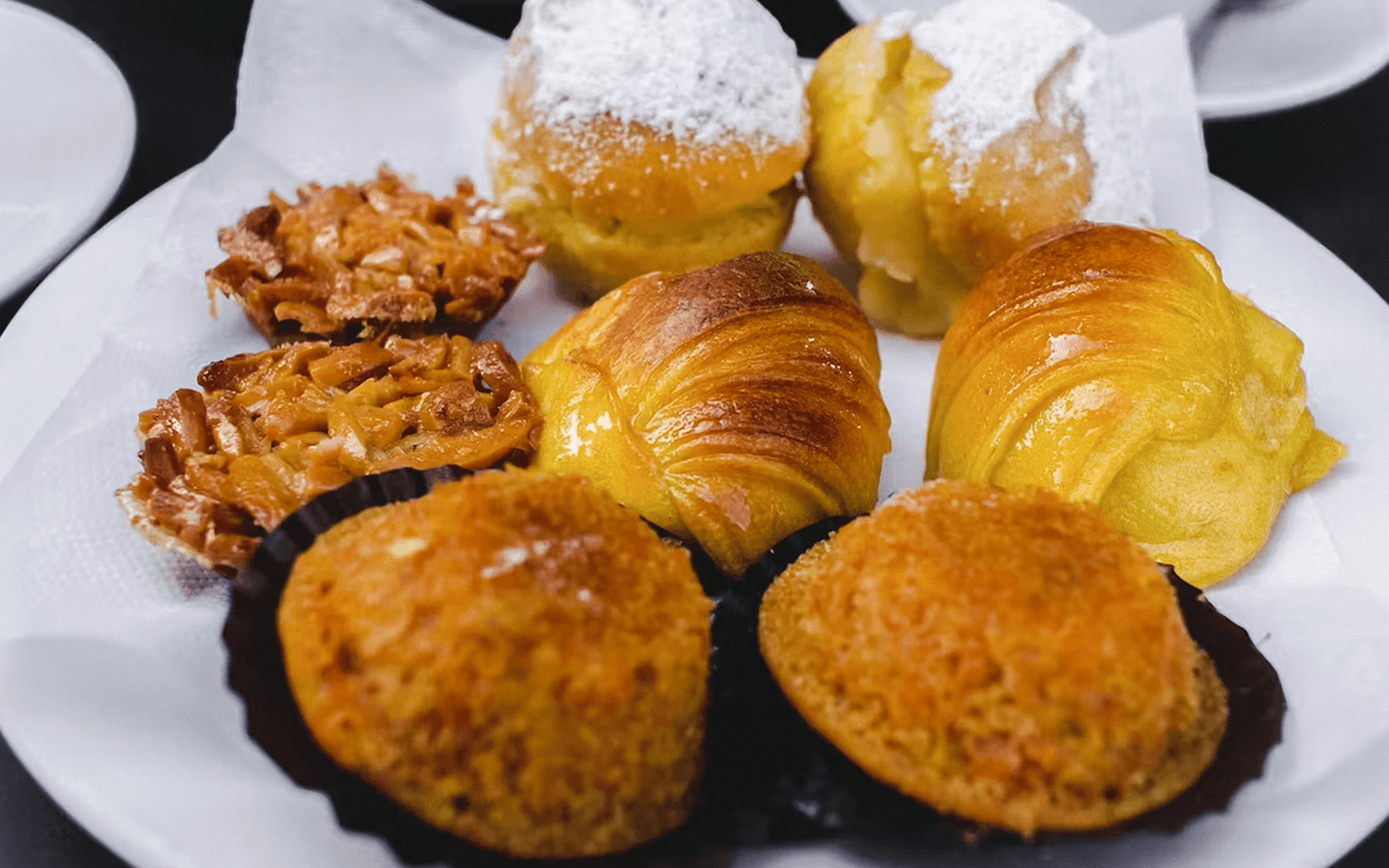 Portuguese pastries on a plate during The Original Porto Petiscos Crawl.