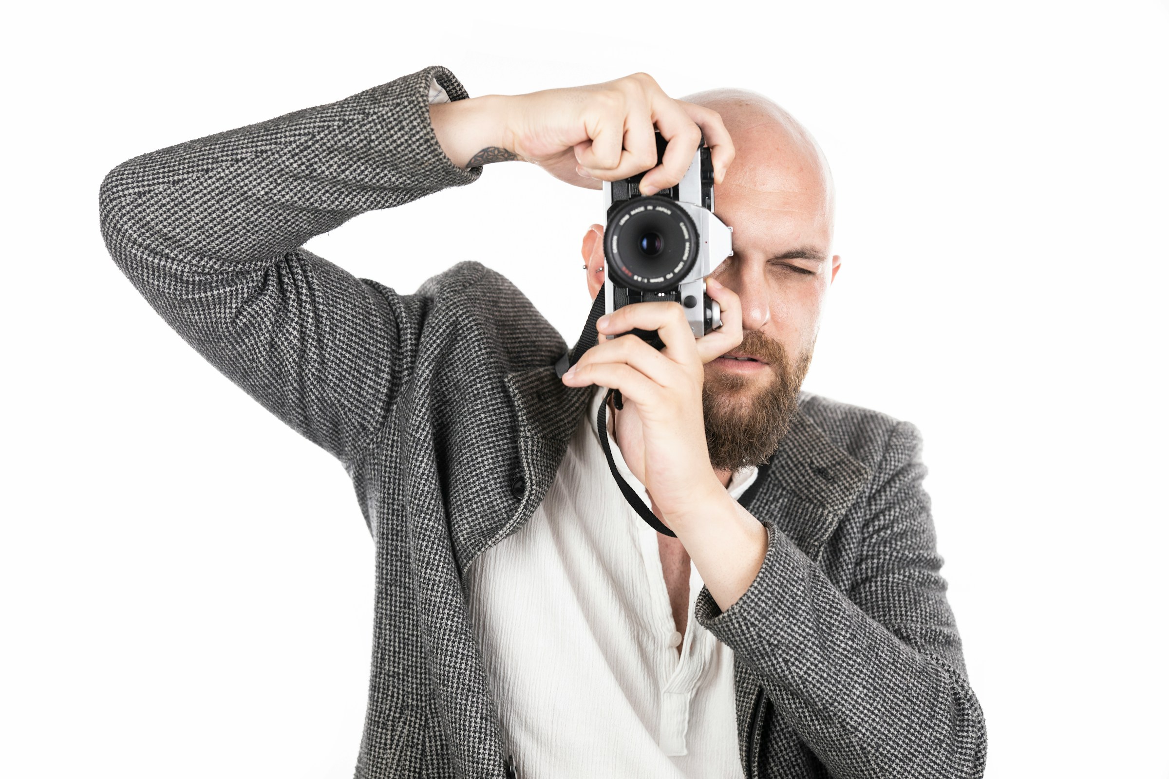 man with camera - How to Take the Best Product Photos