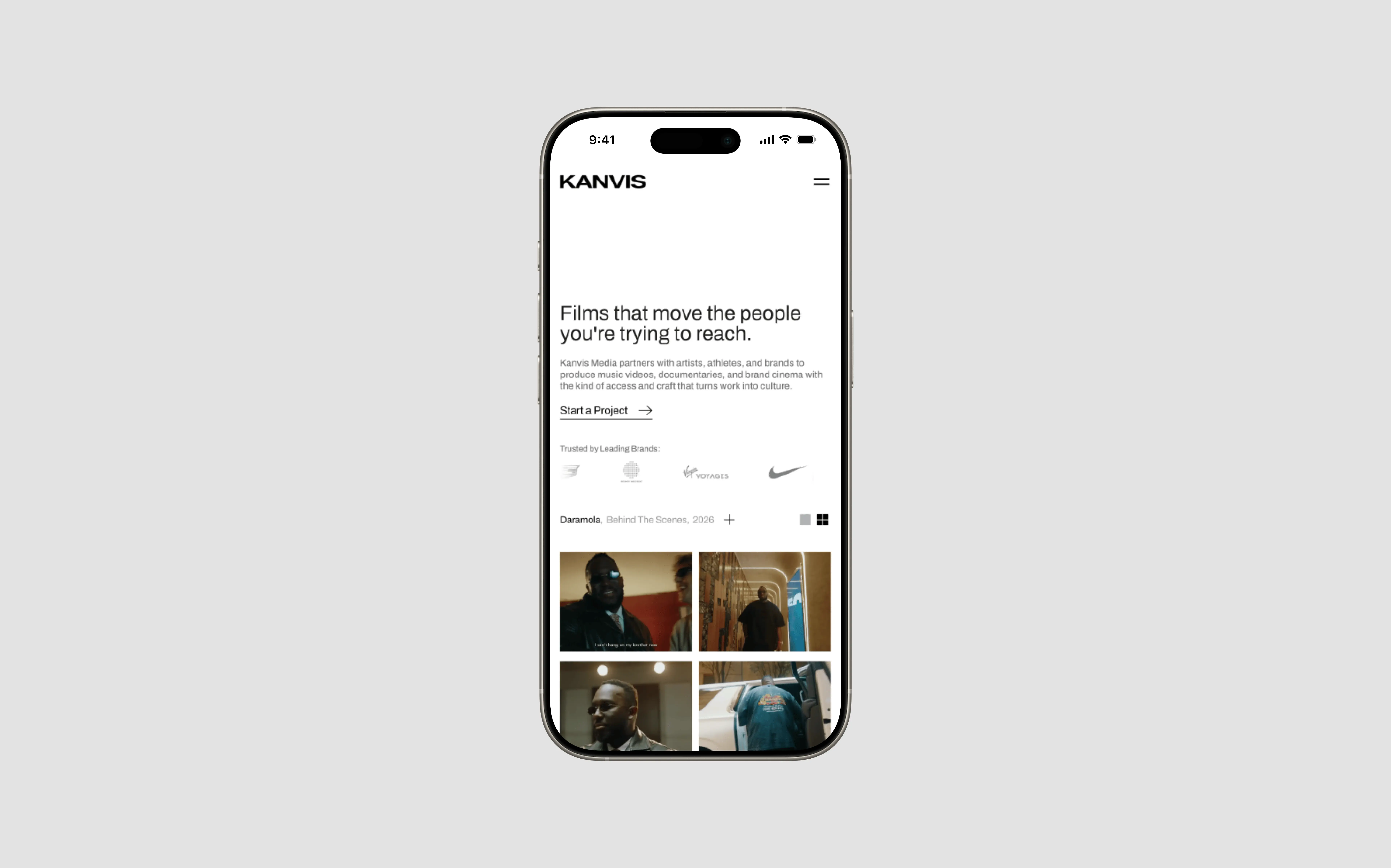 iPhone displaying Kanvis Media website homepage, "Films that move the people you're trying to reach," film portfolio grid