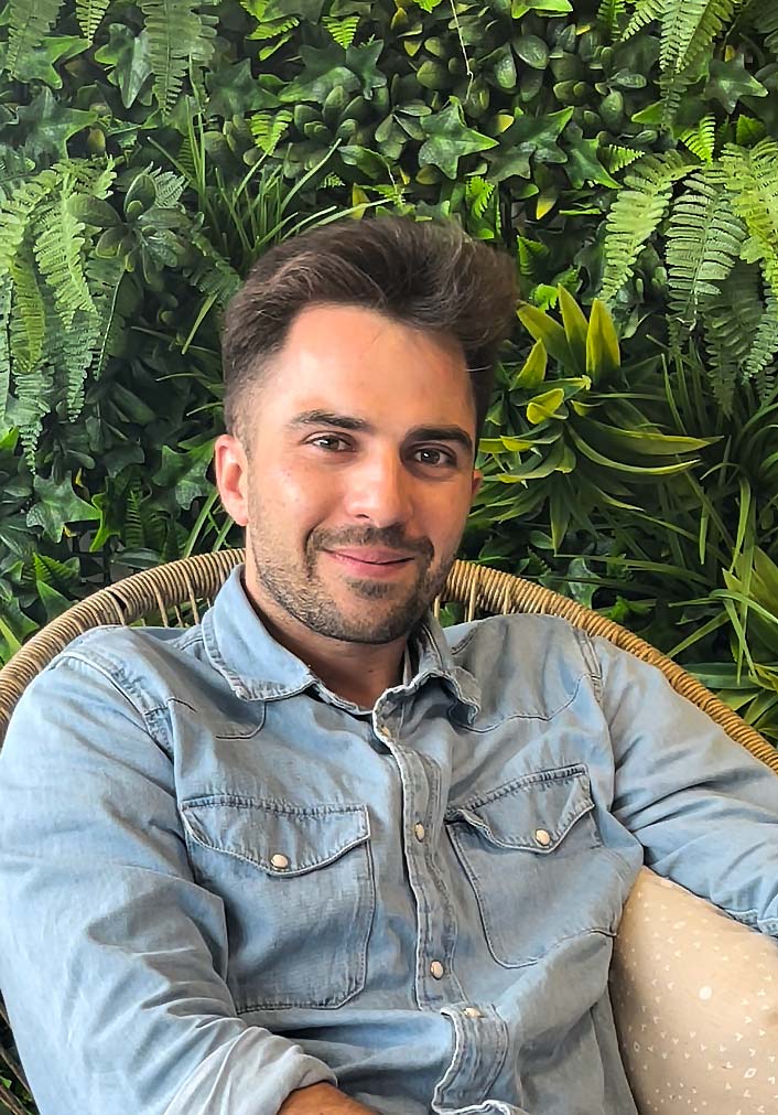 A portrait of a young man smiling