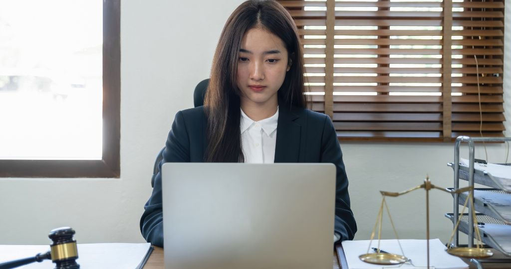 Bookkeeper working on a laptop in an office