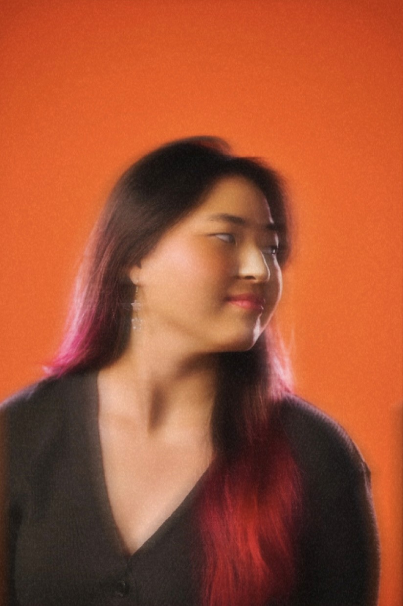 a blurry photo of a person standing in front of a wall