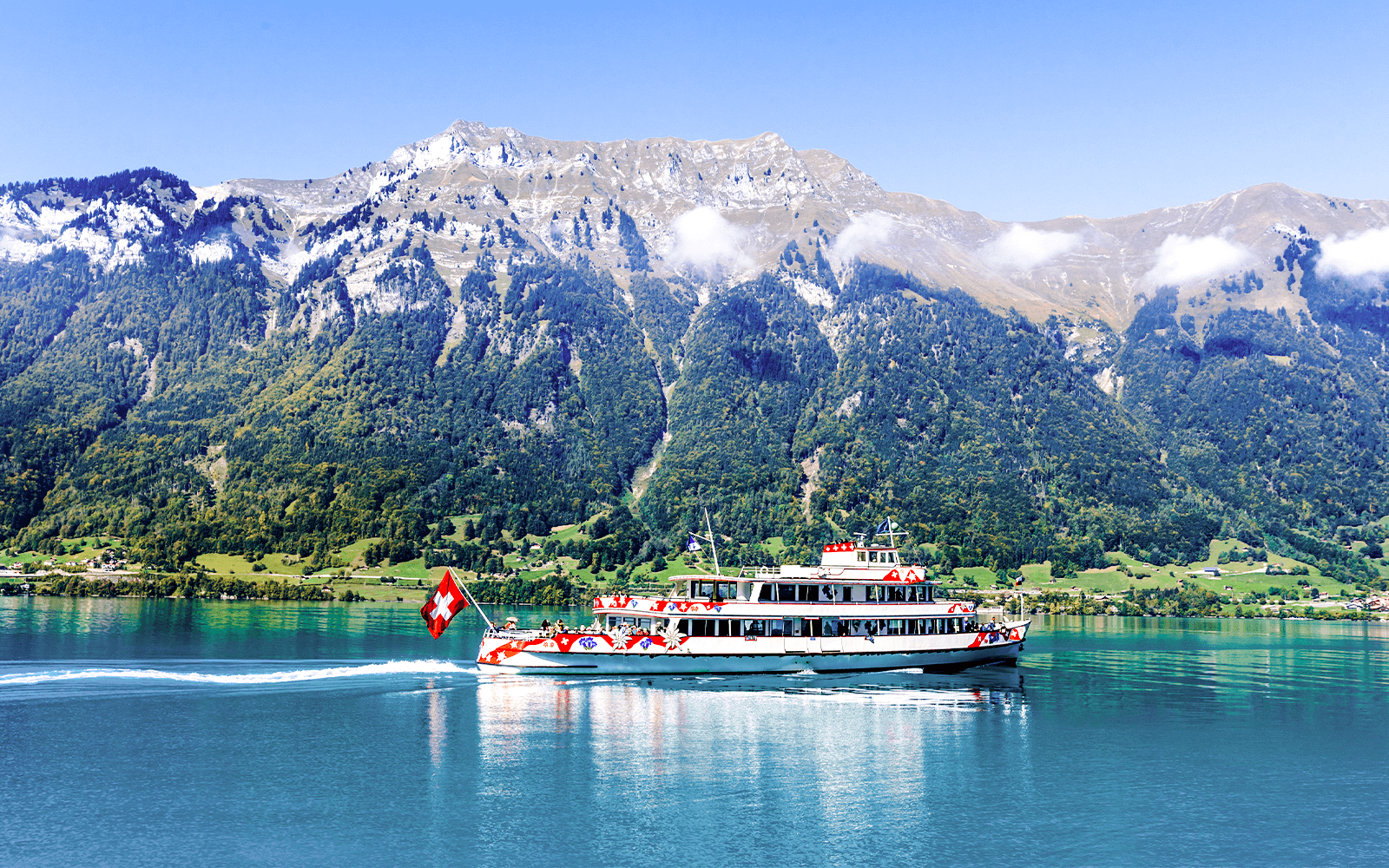 Cruise ship on Lake Brienz with Alps in background, Interlaken.