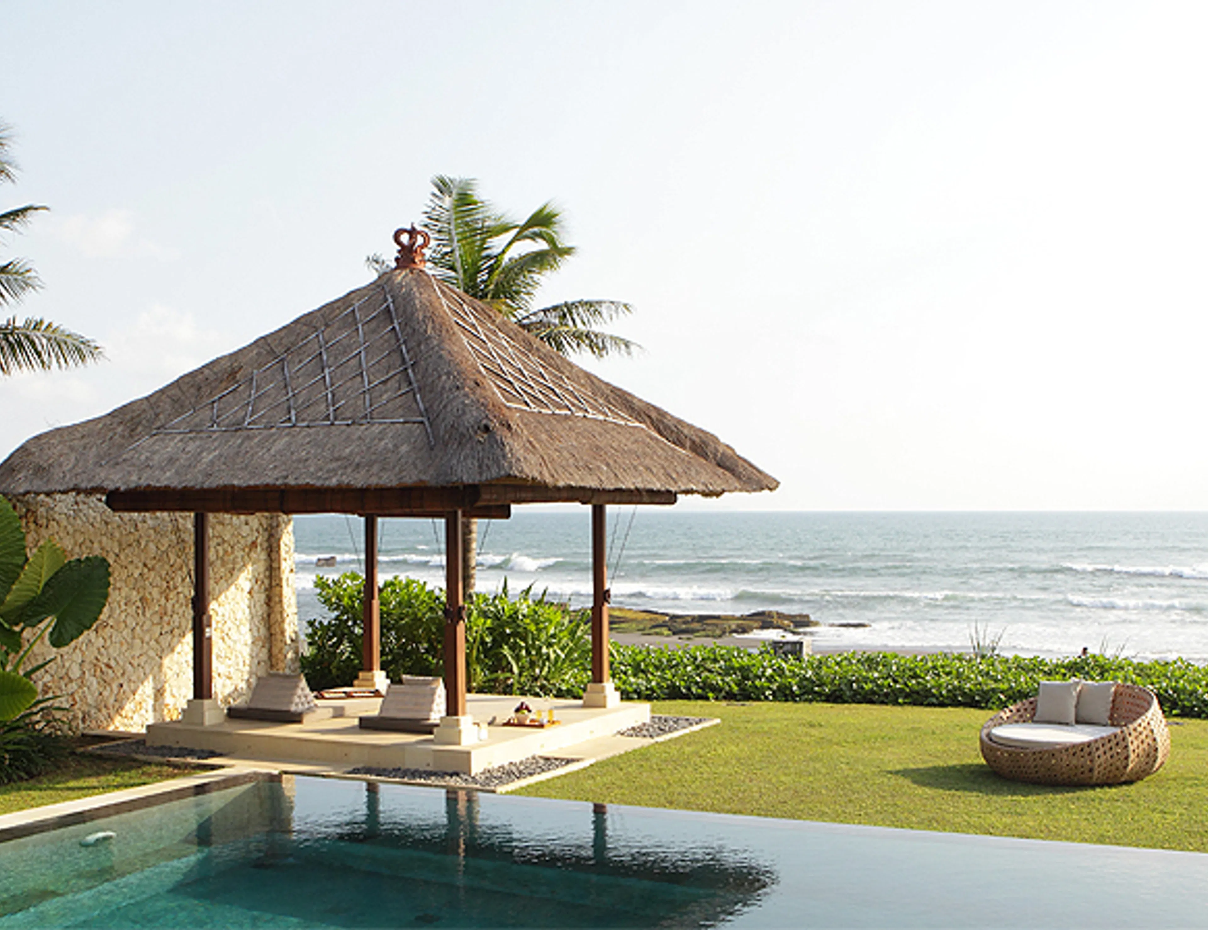 Beachfront gazebo with ocean views in Pererenan; premier real estate services for luxury vacation rentals.