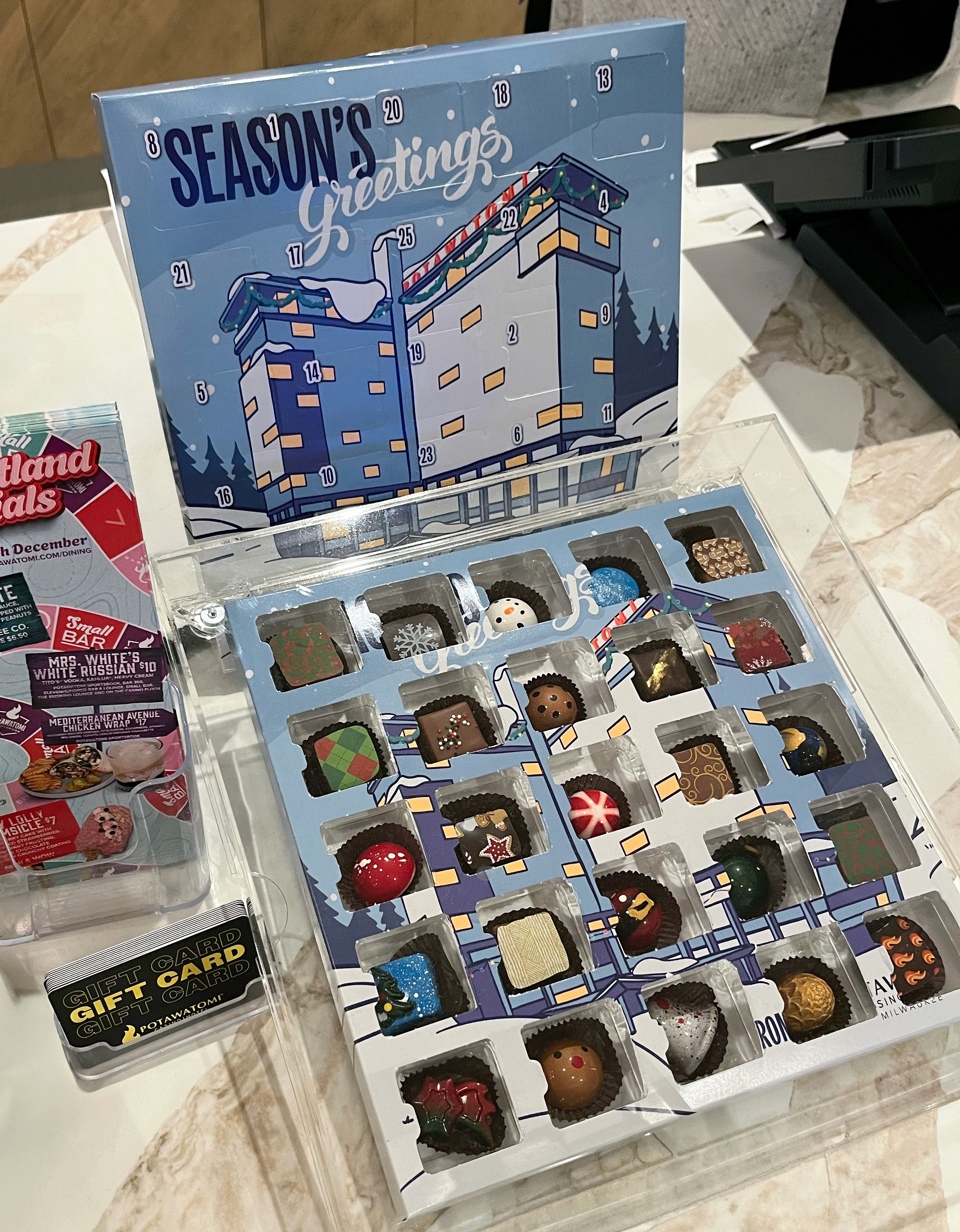display of advent calendar with bon bons inside at coffee shop counter