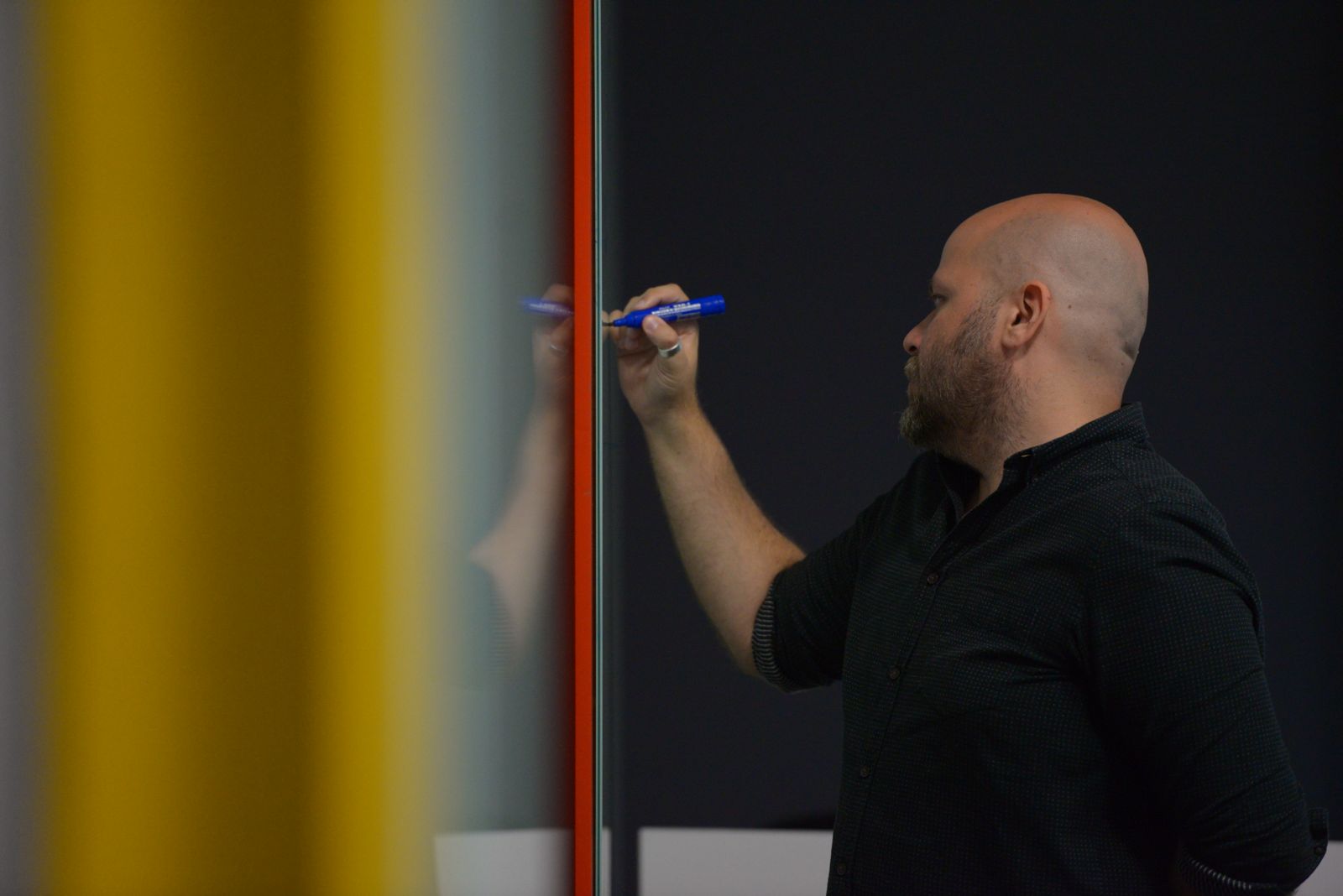 crowd of people sitting on chairs inside room