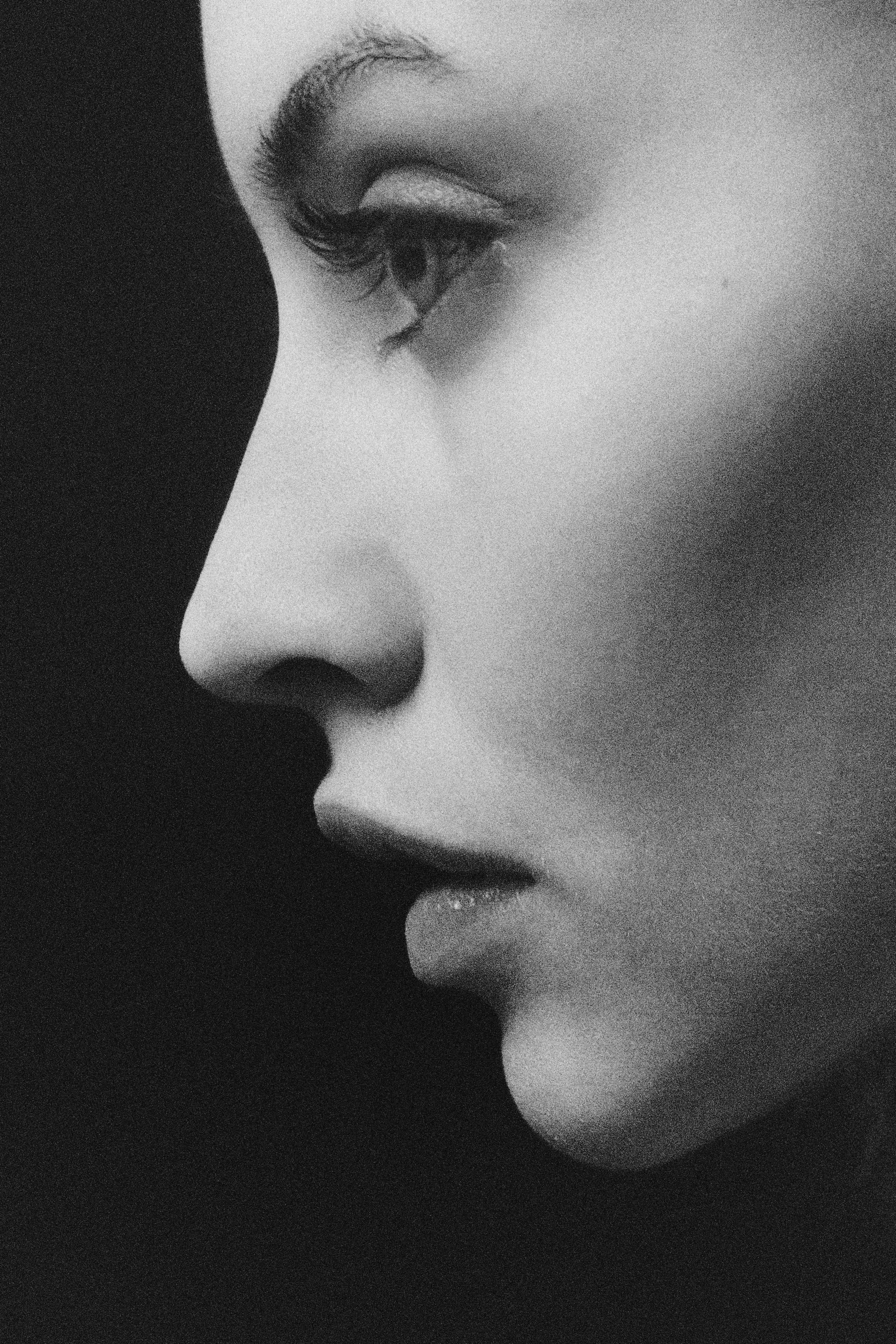 grayscale photo of womans face