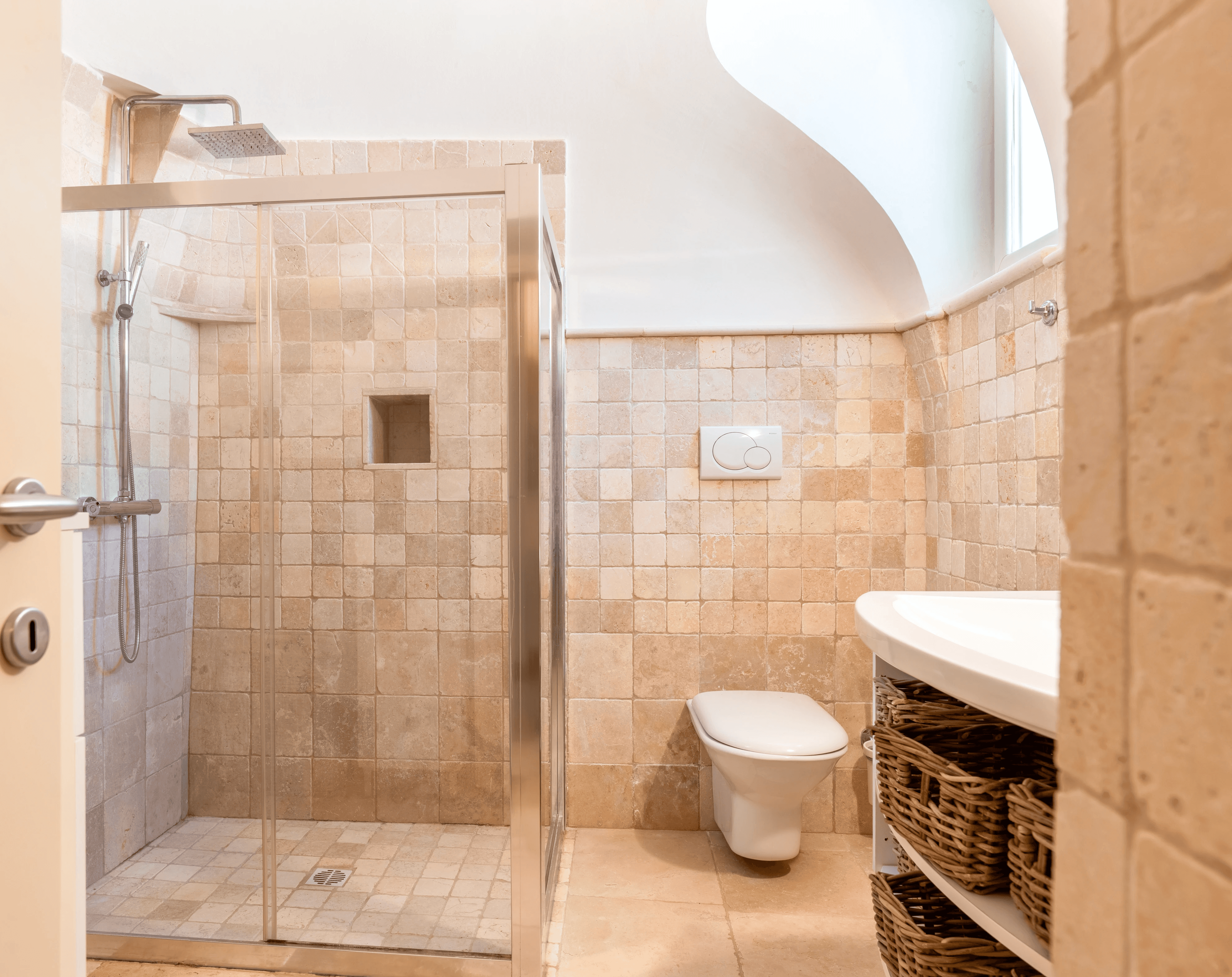 Modern hillside home with terracotta urn and mountain view