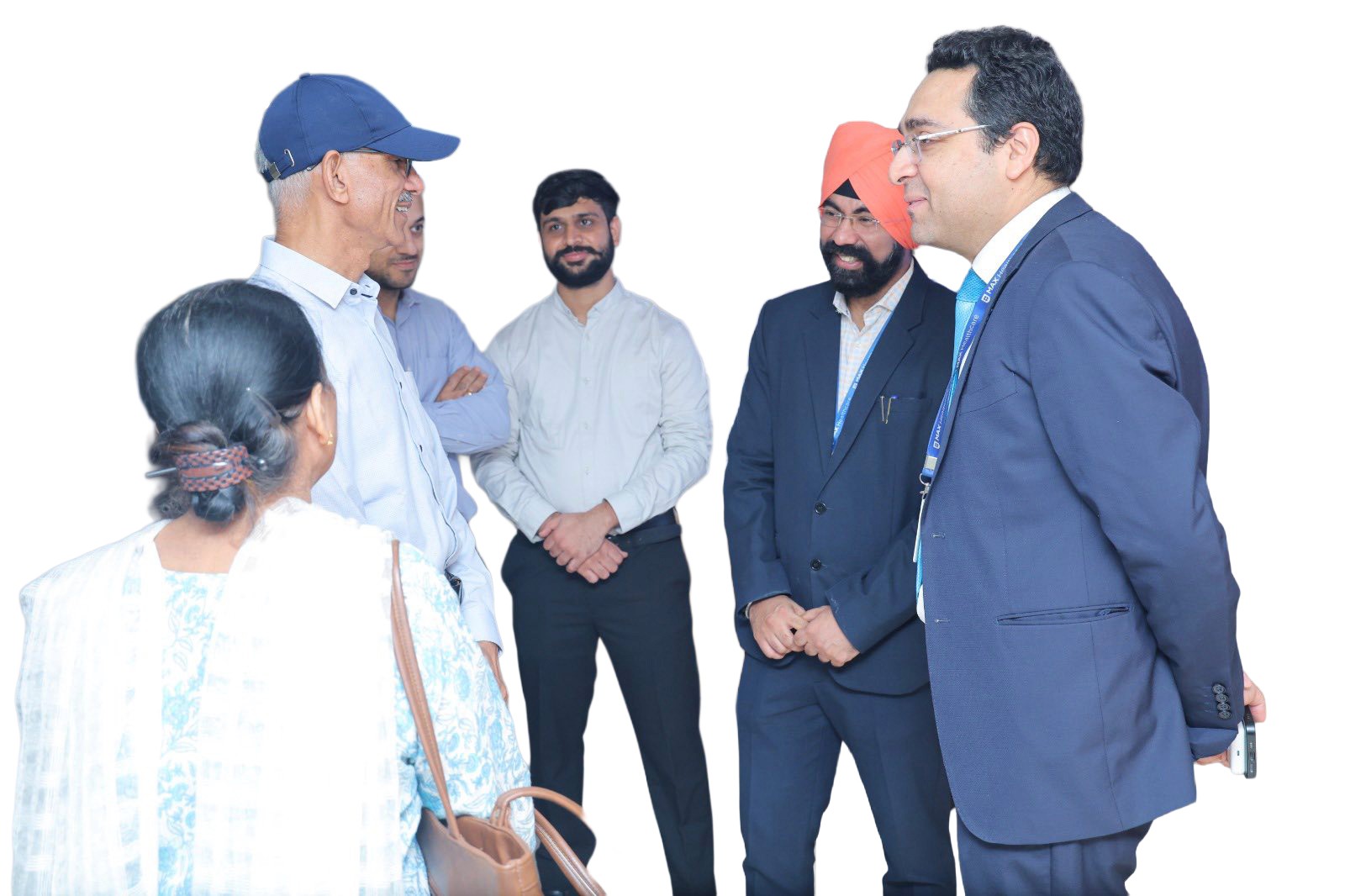 Dr. Tushar, Manpreet, and Manish discussing care plans with a patient’s family.