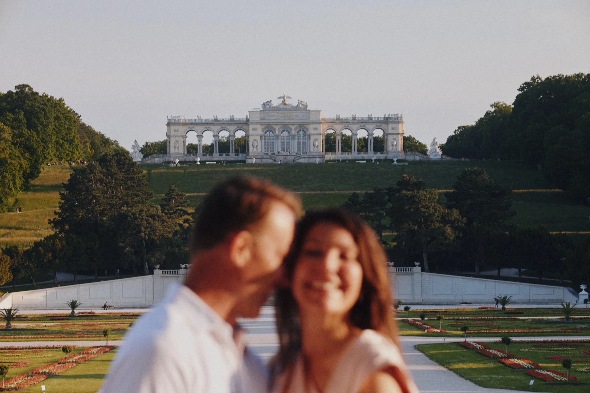 couple out of focus below gloriette — lifestyle photography by Tom Kubik