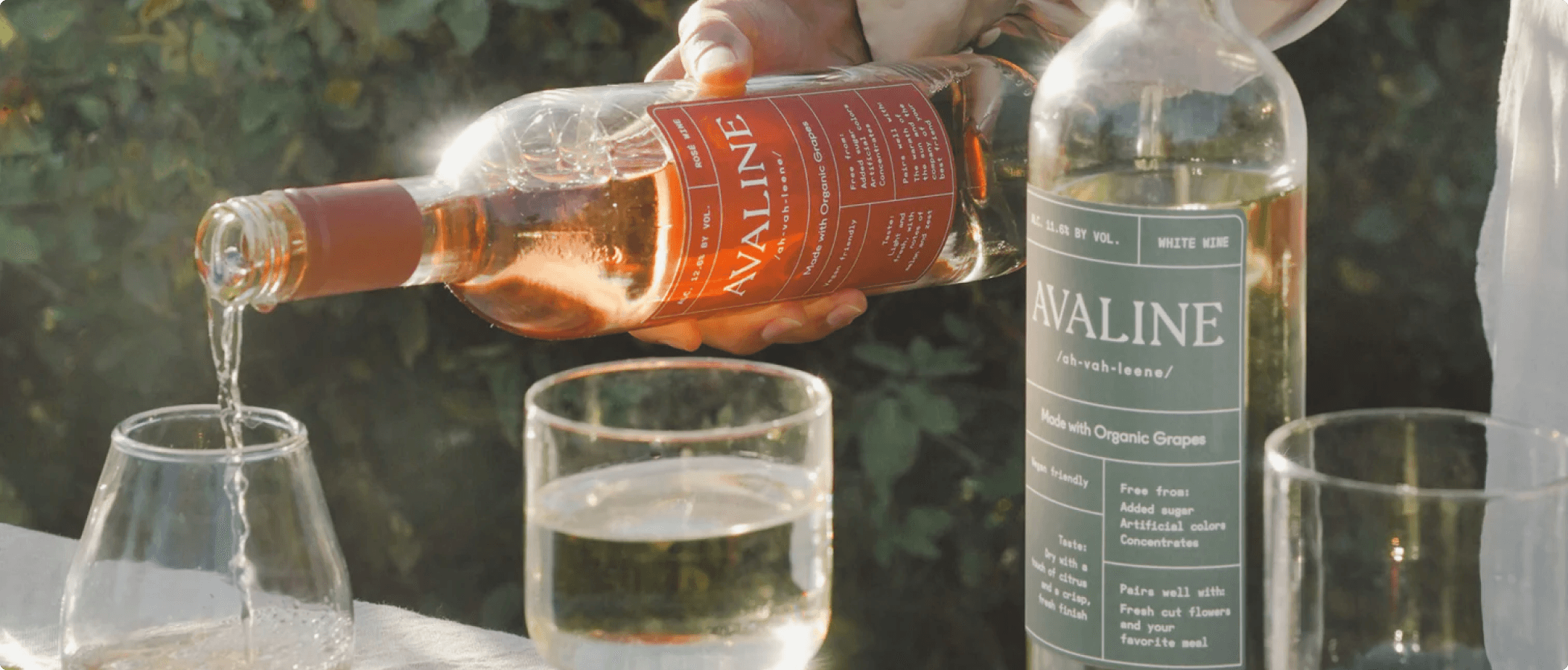 Avaline organic wine being poured into glass during outdoor setting