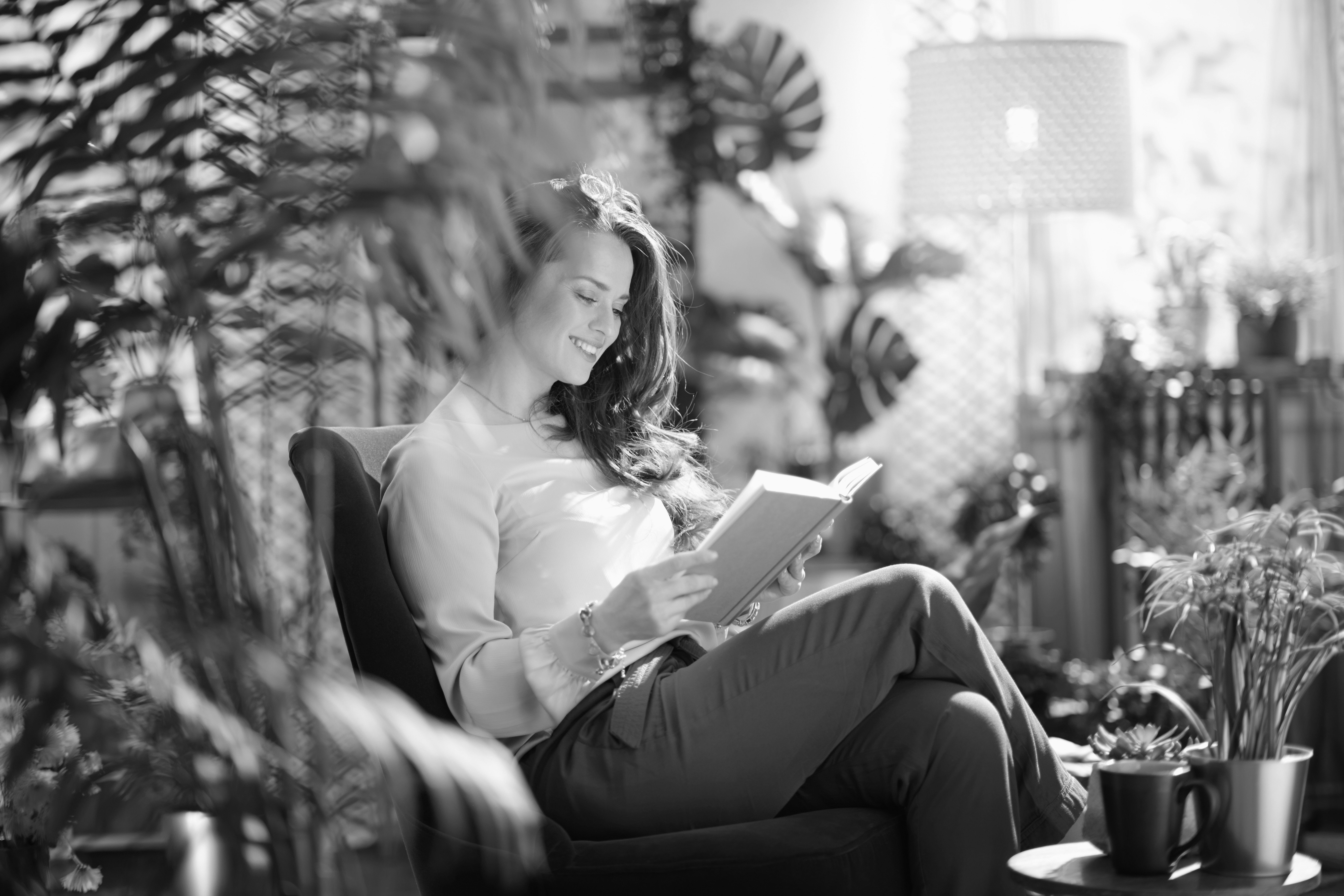 Silhouettes of people on a beach at sunset.